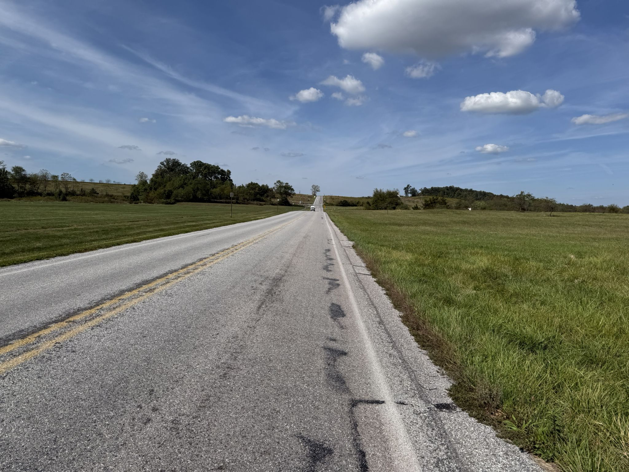 Long, straight paved road extends through green fields under a bright sky. - Observation Tower loop from Gettysburg & Harrisburg Railroad Depot