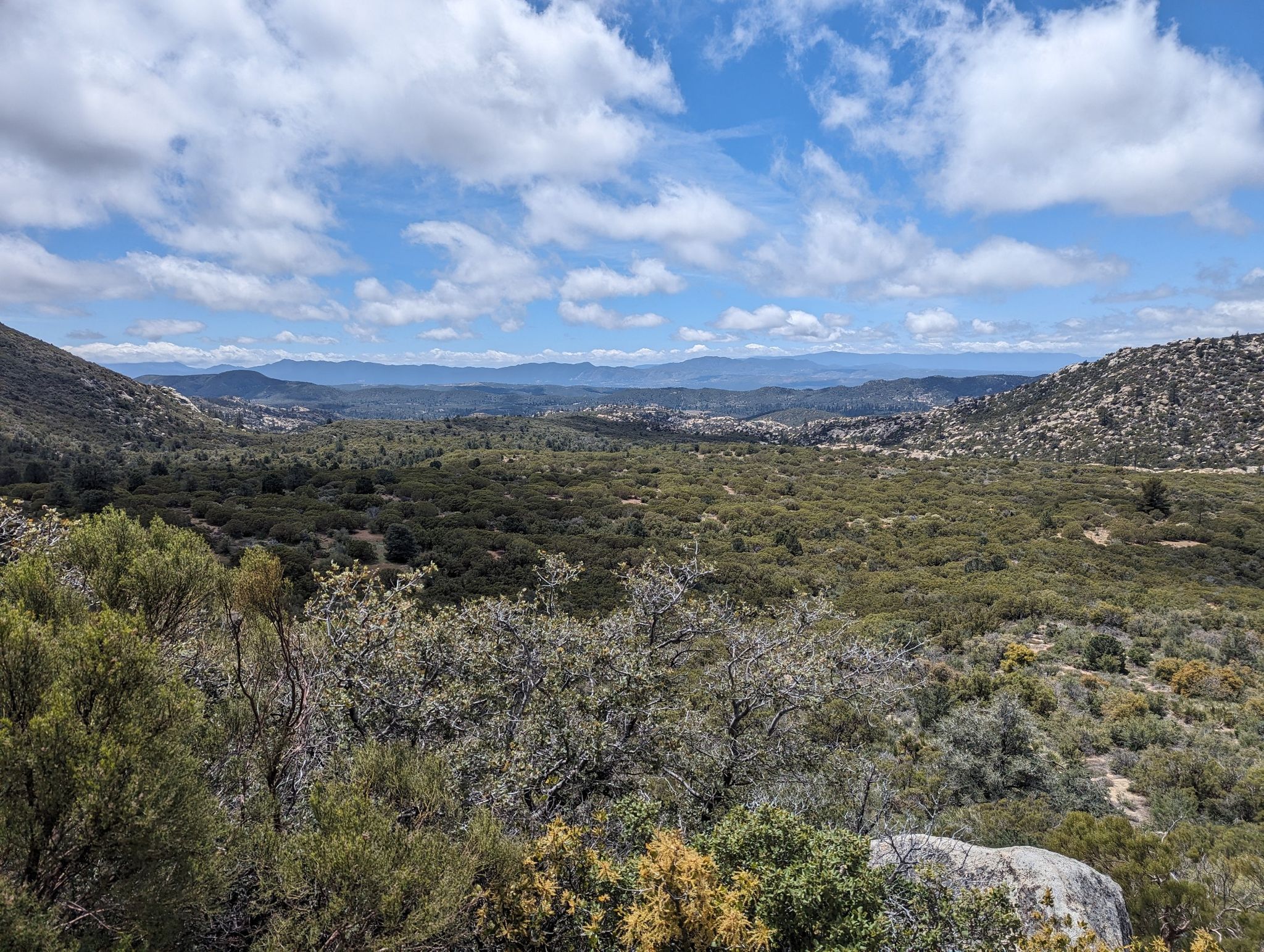 Expansive valley with scrubland and distant hills under a partly cloudy sky. - Live Oak Spring via Pacific Crest Trail