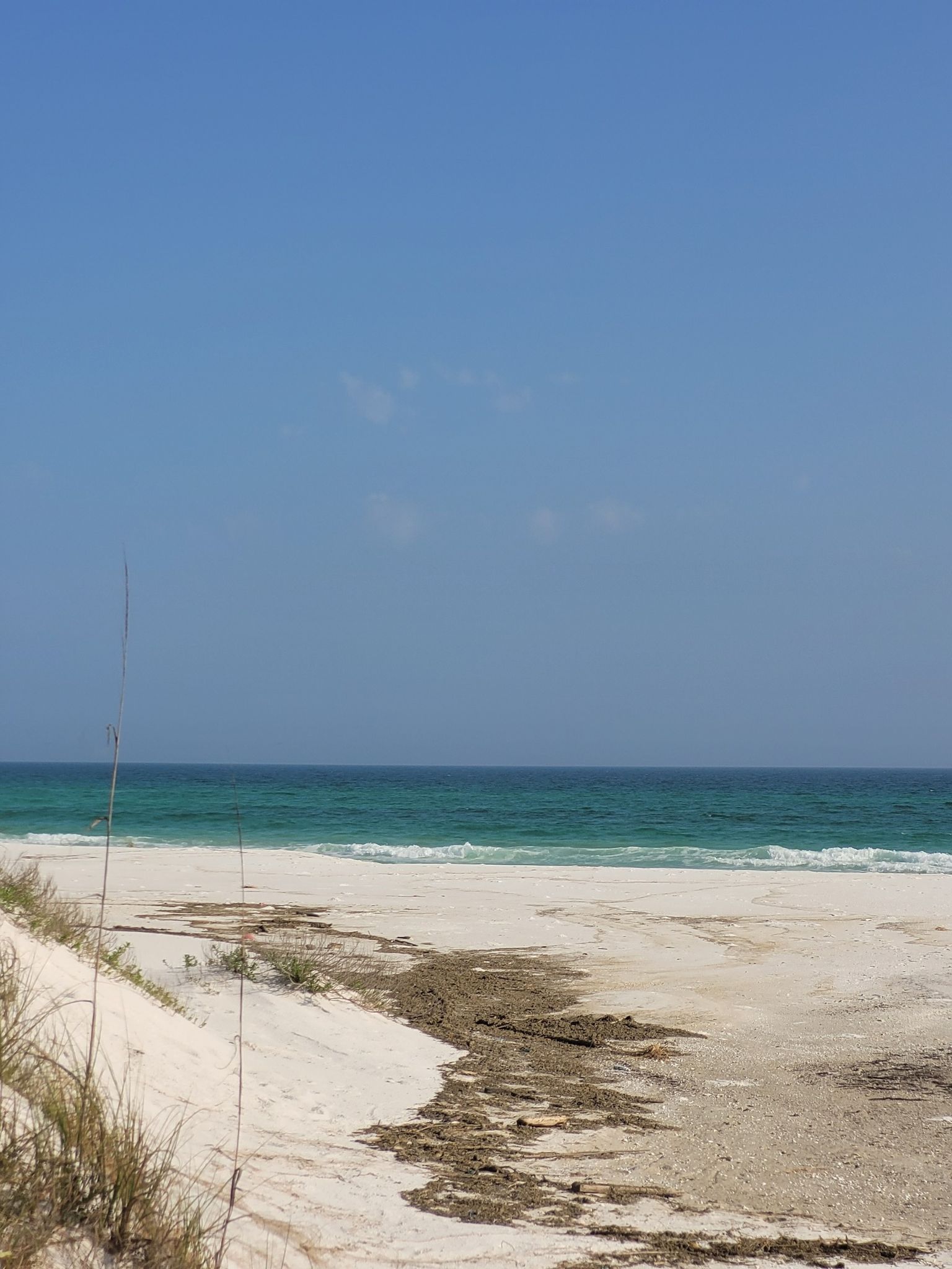 White sand beach meets turquoise ocean under a clear blue sky. - Opal Beach – Gulf Islands National Seashore loop from Pensacola Beach Water Tower