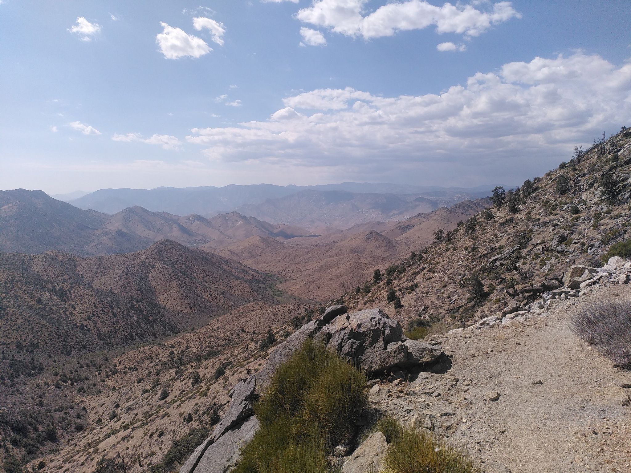 Vast desert mountains and valleys under a partly cloudy sky. - Morris Peak via Walker Pass