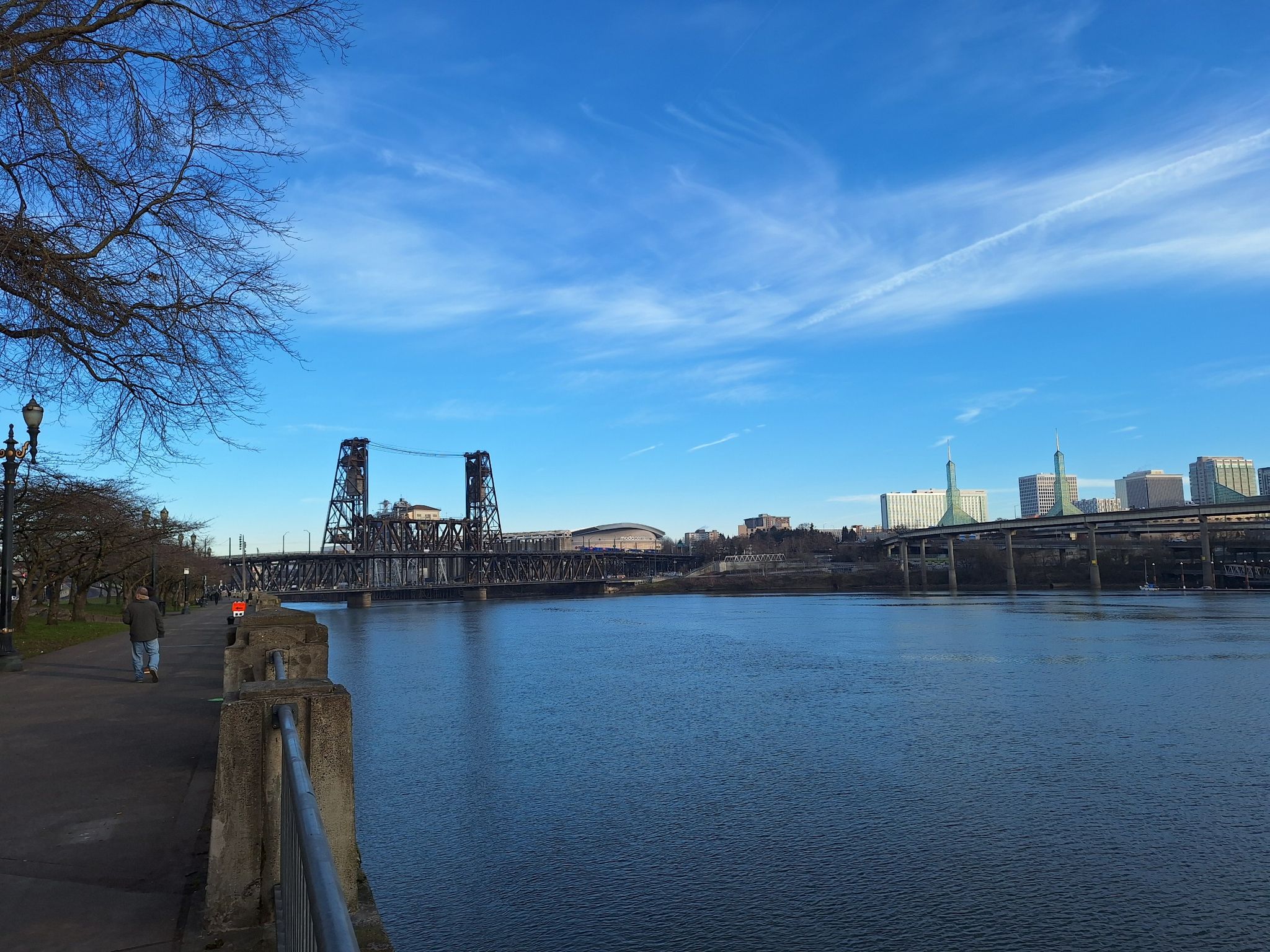 A large metal bridge spans a river under a bright blue sky. - Leif Erikson Drive – Northwest Leif Erikson Drive loop from South Waterfront/South Moody