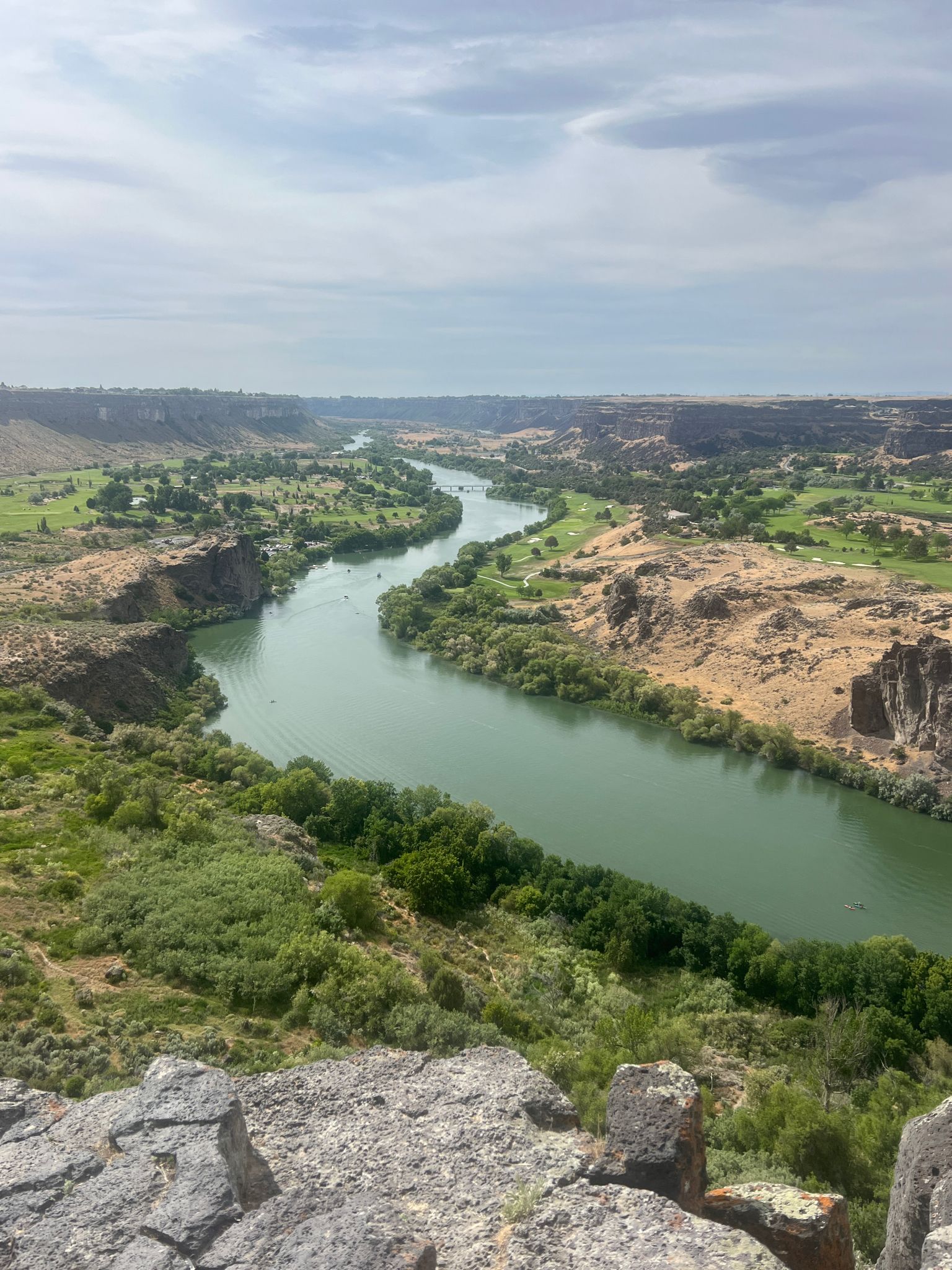 Green river winds through a wide, arid canyon landscape. - Perrine Bridge - Twin Falls – Snake River - Canyon Rim Trail loop from Twin Falls Idaho Temple