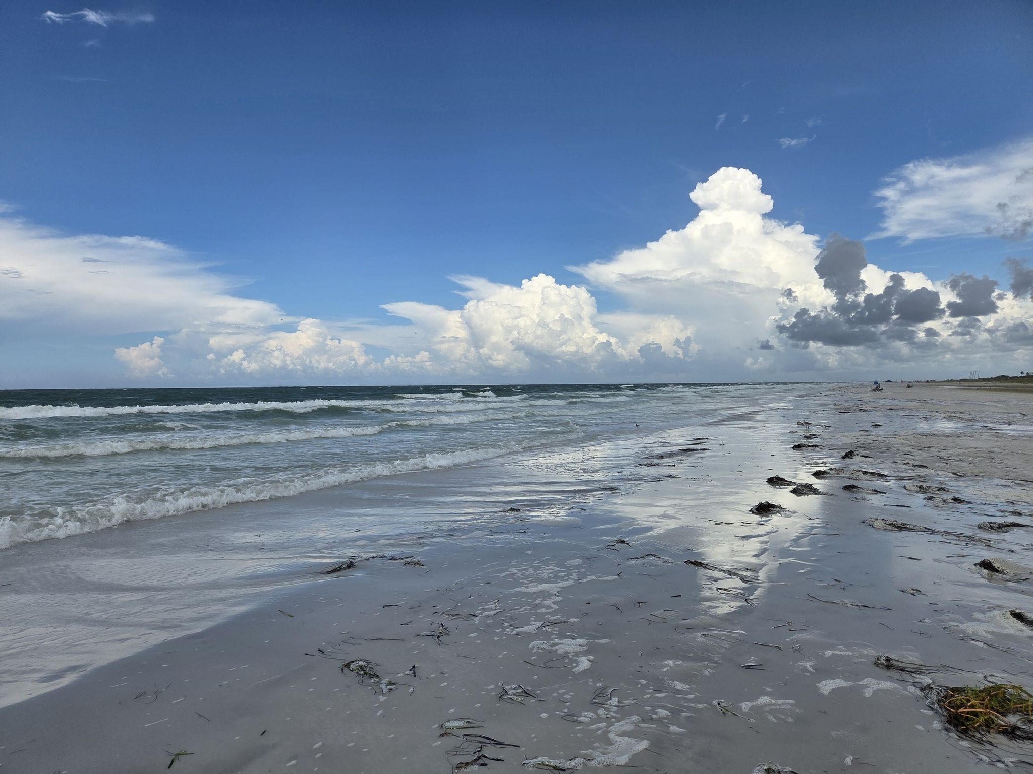 Wide sandy beach with ocean waves under a bright, cloudy sky. - Crescent Beach loop from Siesta Key
