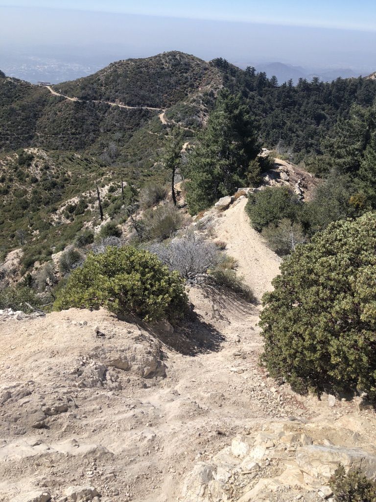Dirt trail winding through arid, brush-covered mountain terrain. - Mount Lowe and Echo Mountain Loop