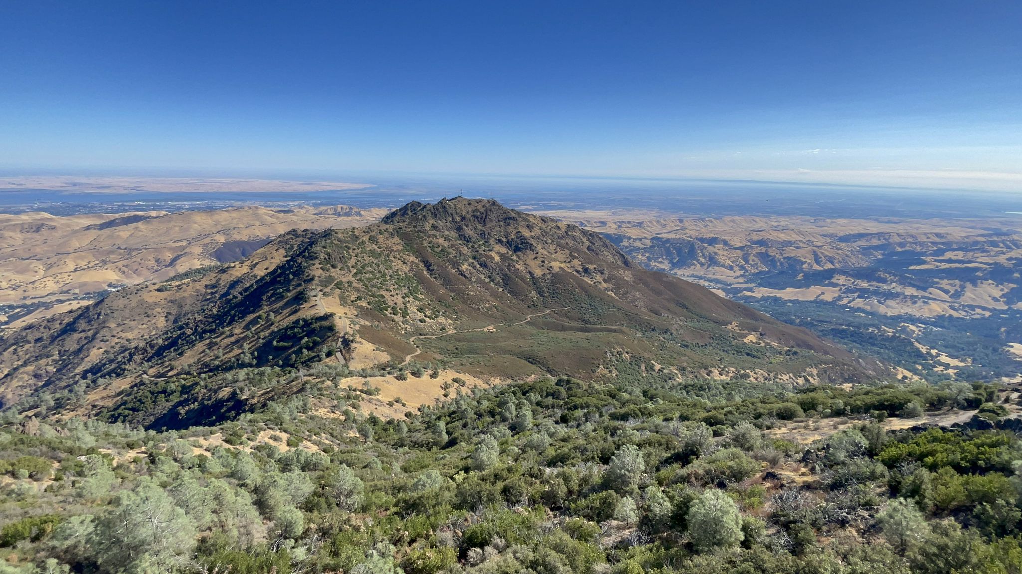 Panoramic view of a prominent mountain peak surrounded by vast, arid landscapes. - Mount Diablo Summit – Ygnacio Canal Trailhead loop from Contra Costa Centre