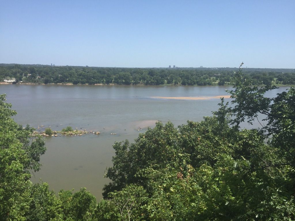 Wide river with distant treeline under a clear, sunny sky. - Pepsi Lake – View of the Arkansas River loop from Turkey Moutain - Upper Lot