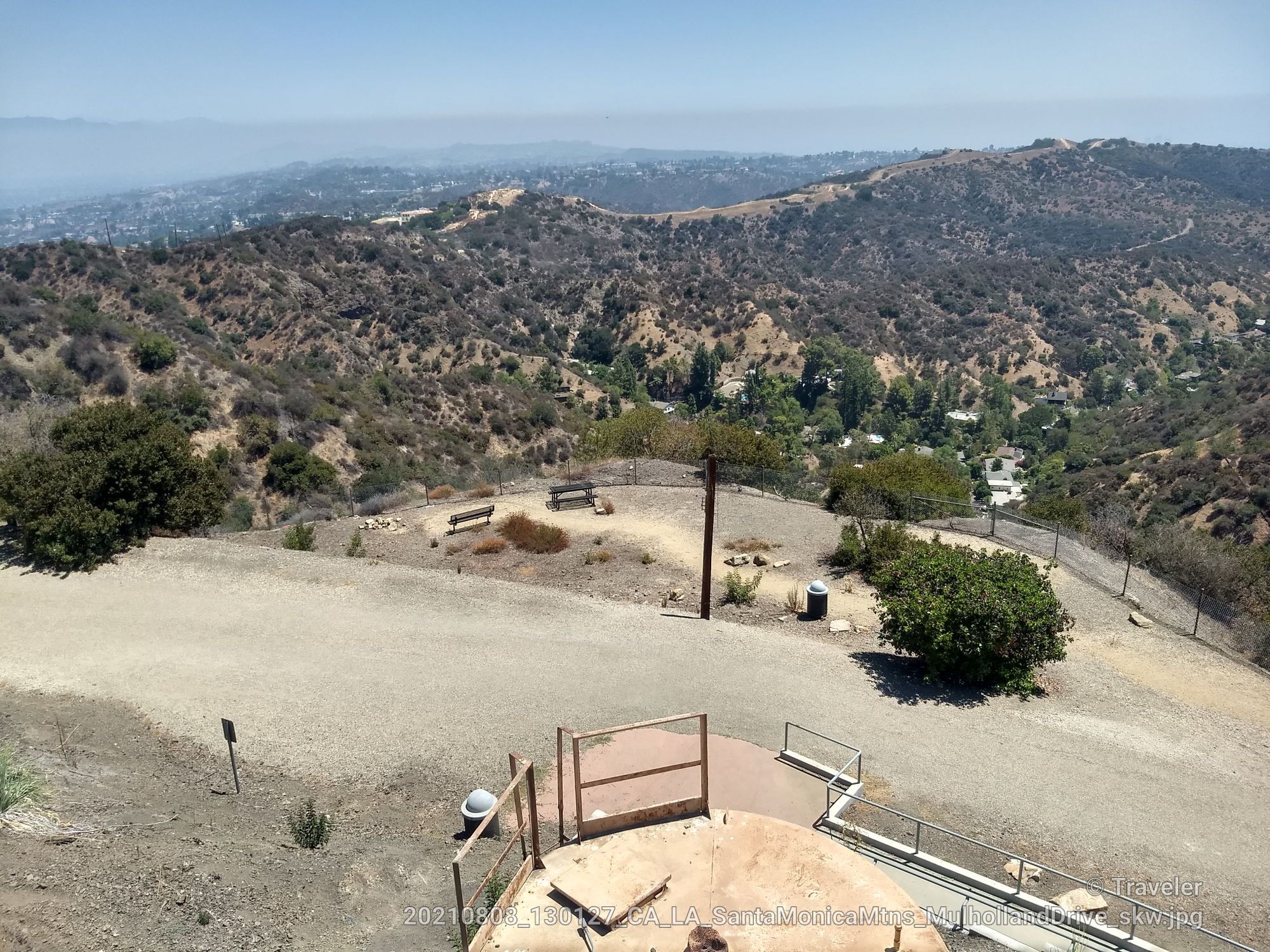 Overlook with benches on a dry hill, distant city under clear blue sky. - Old Nike Missile Tower – San Vicente Mountain Viewpoint loop from MRCA Open Space