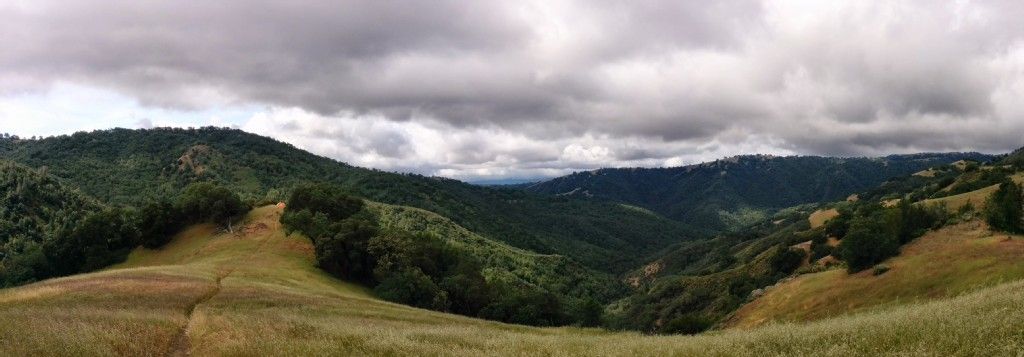 Panoramic view of rolling green hills and valleys under a cloudy sky. - Kelly Lake, Coit Lake & Wilson Peak loop from Hunting Hollow Trailhead