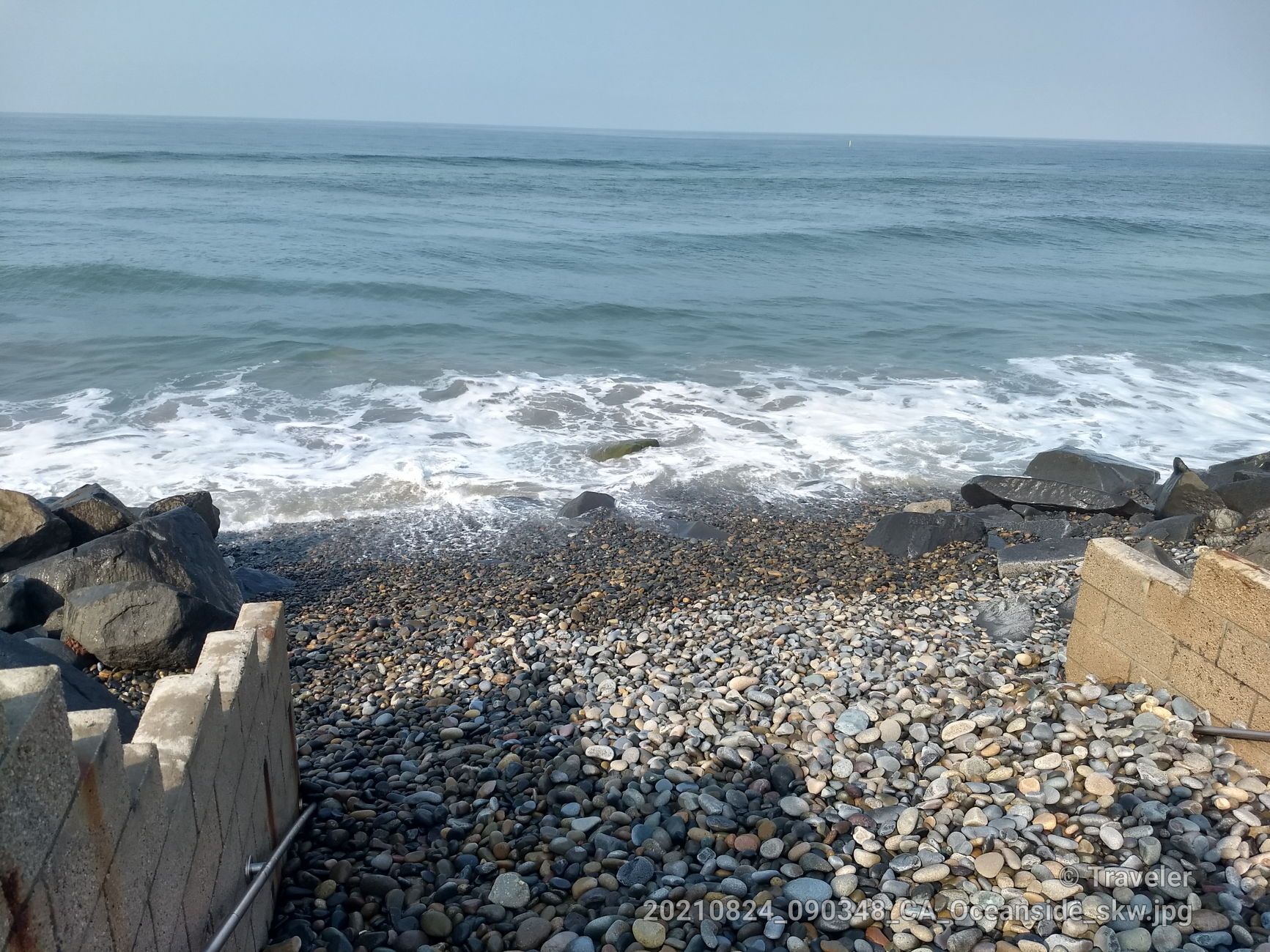 Rocky beach with ocean waves crashing, concrete steps, under bright daylight. - Loma Alta Creek – Buccaneer Beach Park loop from Carlsbad