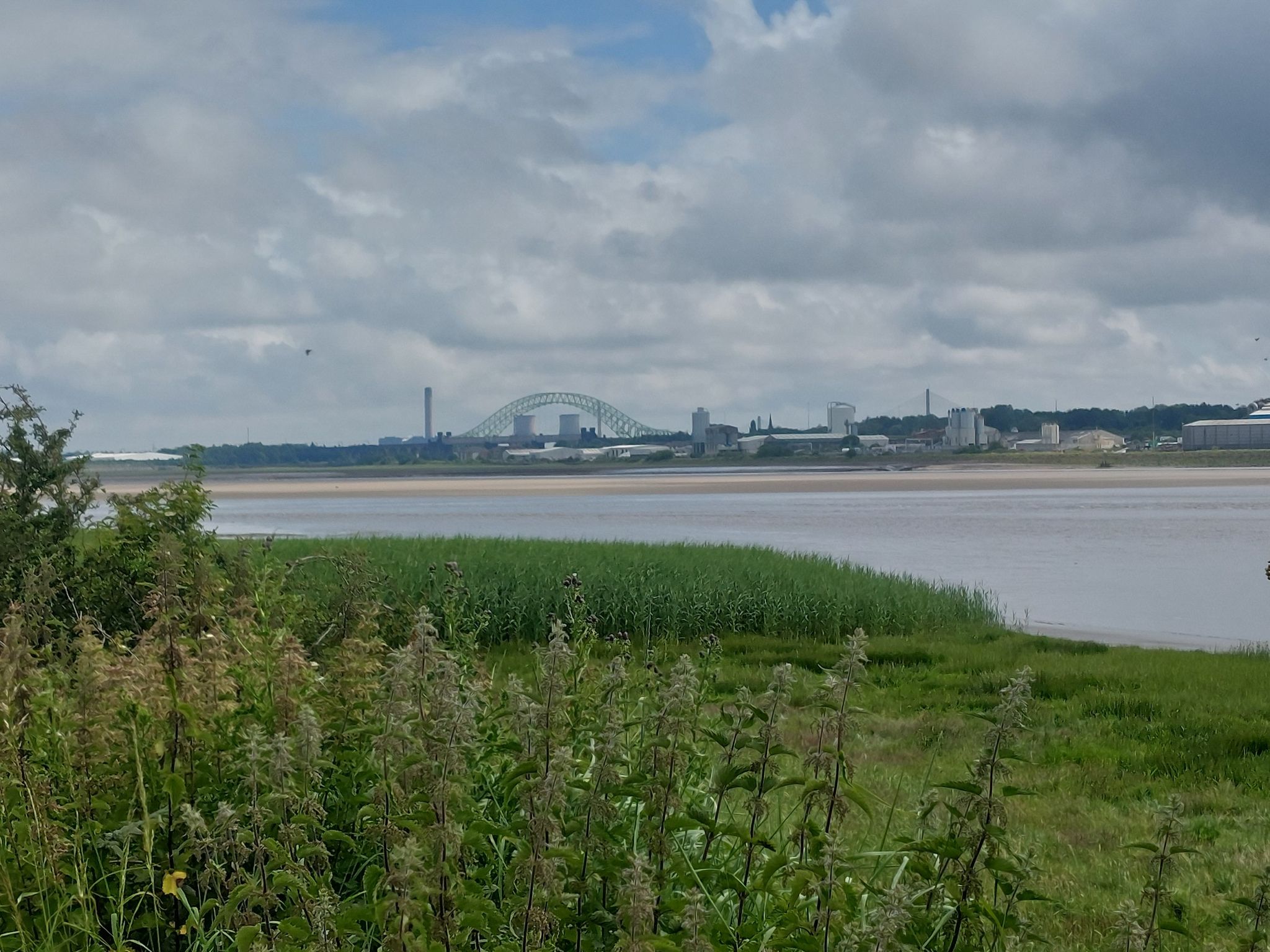 The 'Old' Runcorn Bridge with the suspension cables of the 'New' Runcorn Bridge visible on the right