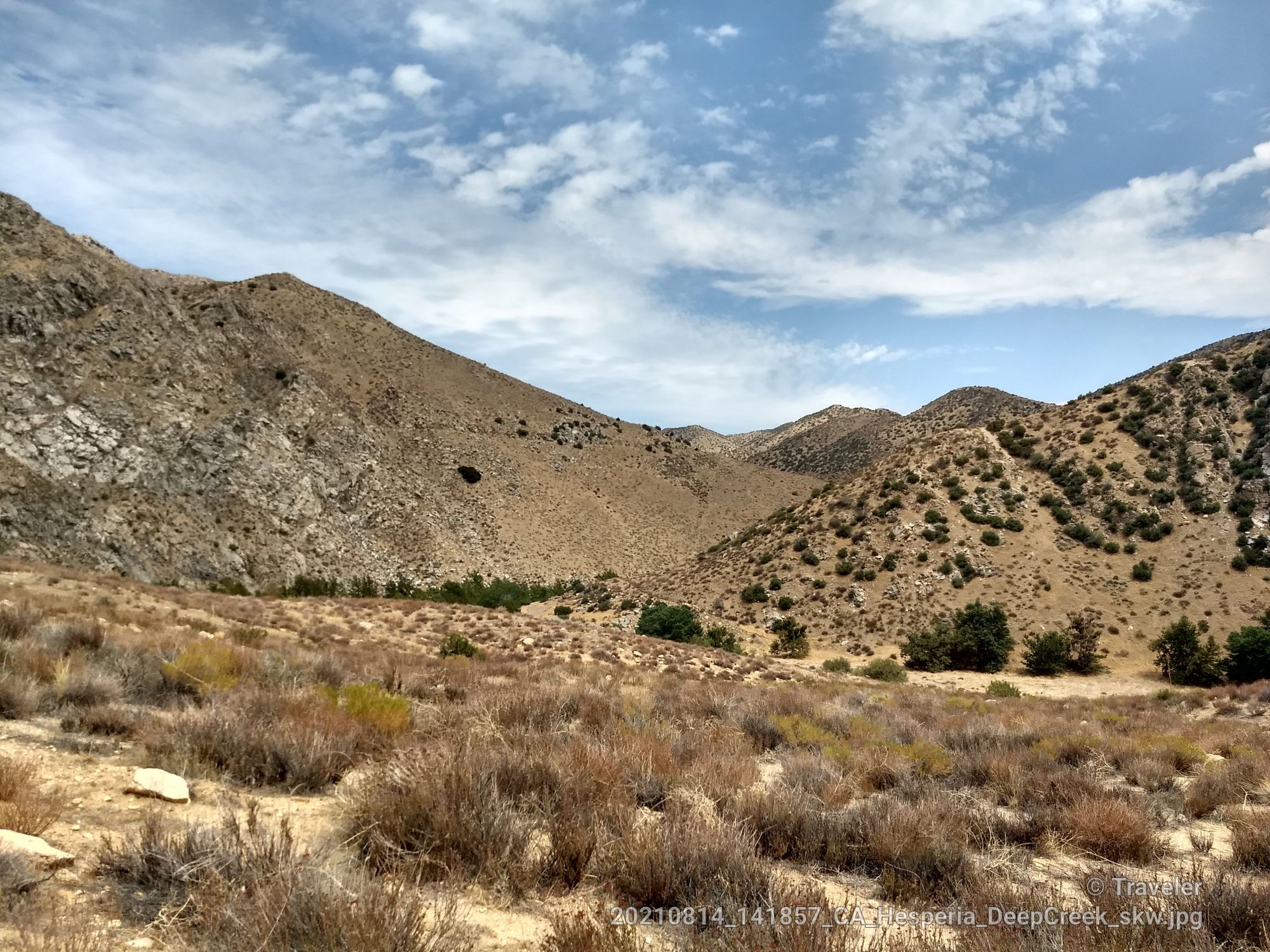 Arid mountains and scrubland under a partly cloudy sky. - Deep Creek Hot Springs – San Bernardino National Forest