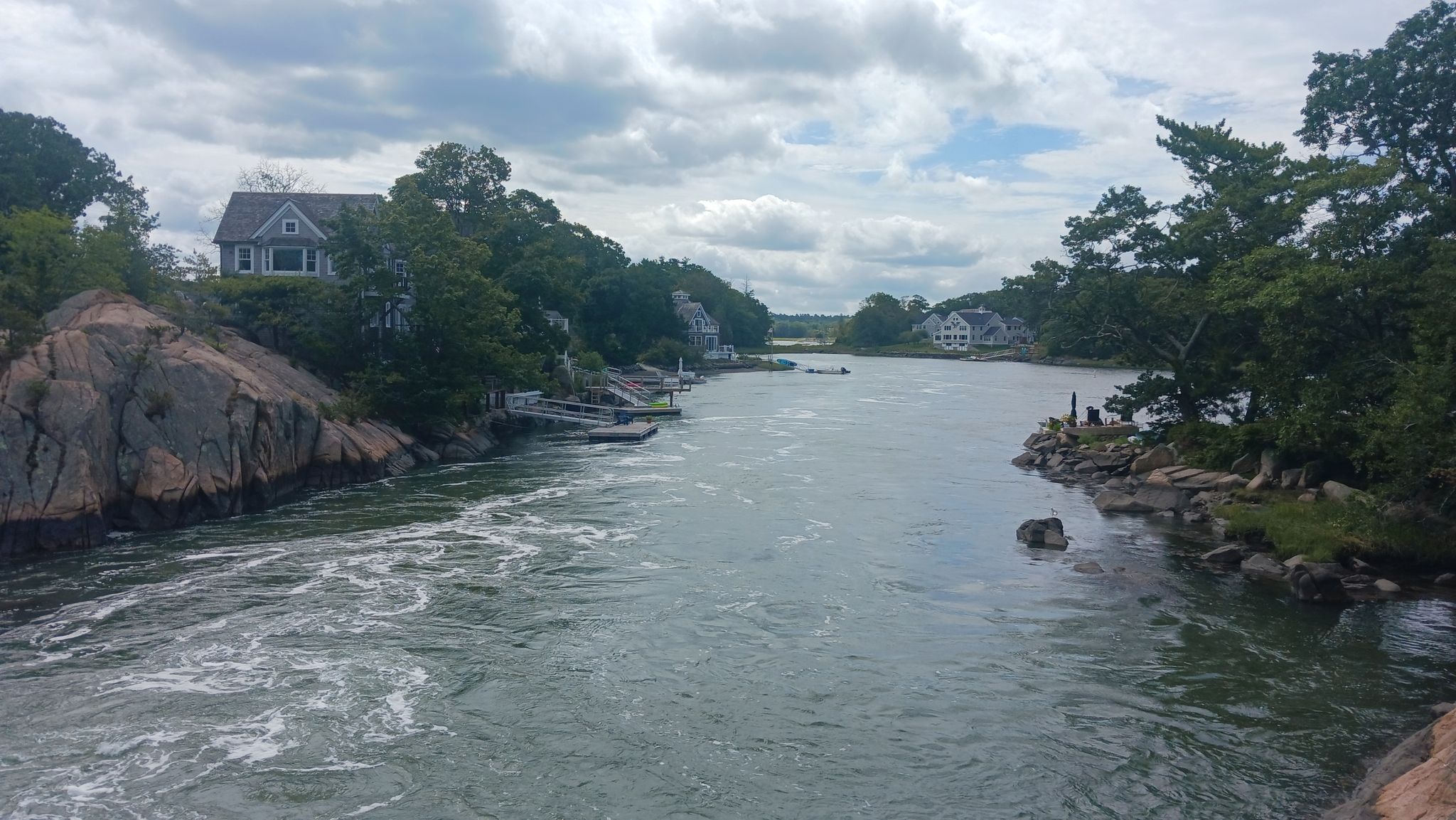 River flowing between rocky, tree-lined banks with houses and boats. - Wompatuck State Park – Wompatuck State Park loop from Greenbush