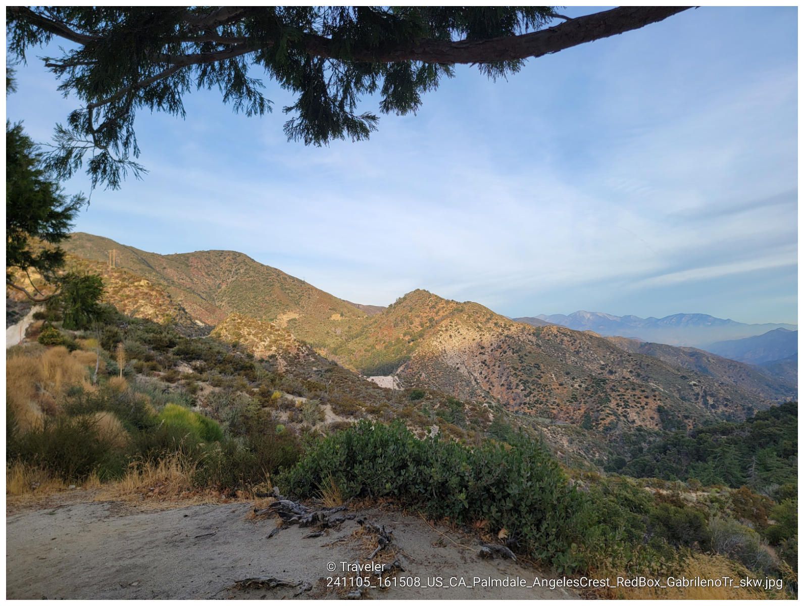 Sunny view of rugged mountains and a valley with scrubby vegetation. - Strawberry Peak Trail via Redbox Canyon