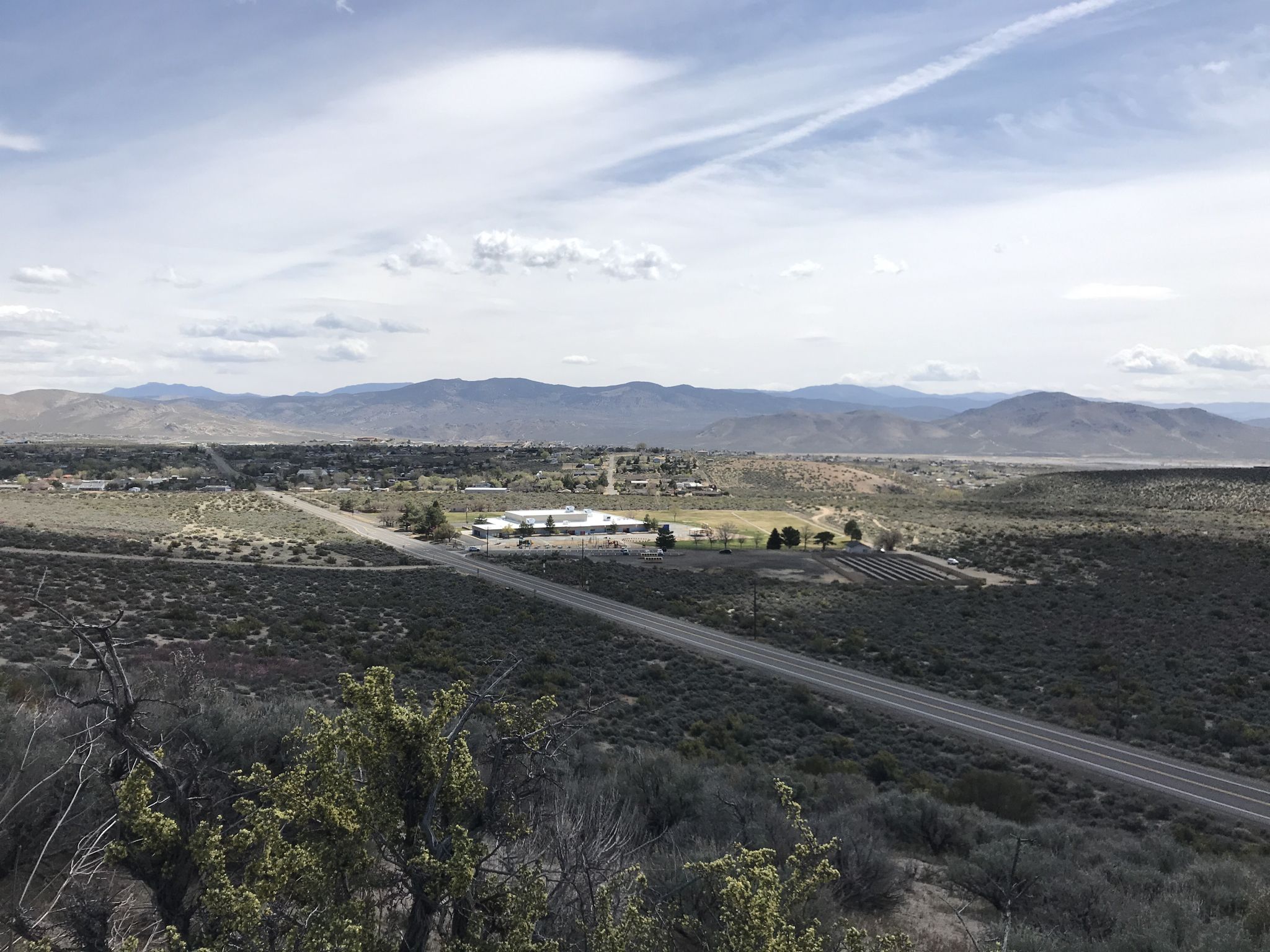 Overhead view of a long road and buildings in a wide, arid valley. - Clear Creek Trail loop from Indian Hills