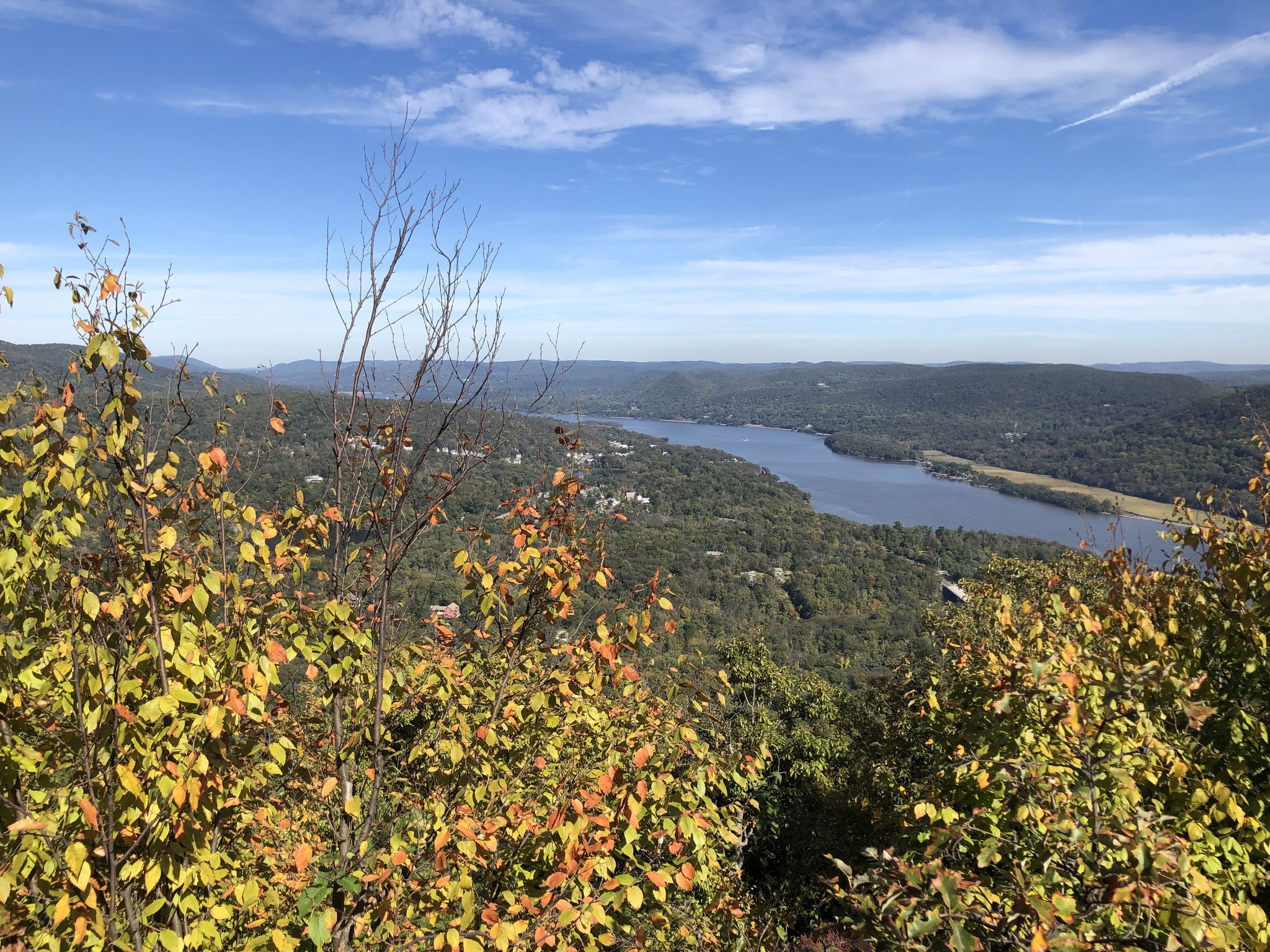 Scenic view of a river flowing through a valley of green and autumn-colored trees. - Bear Mountain Loop via Major Welch and Appalachian Trail