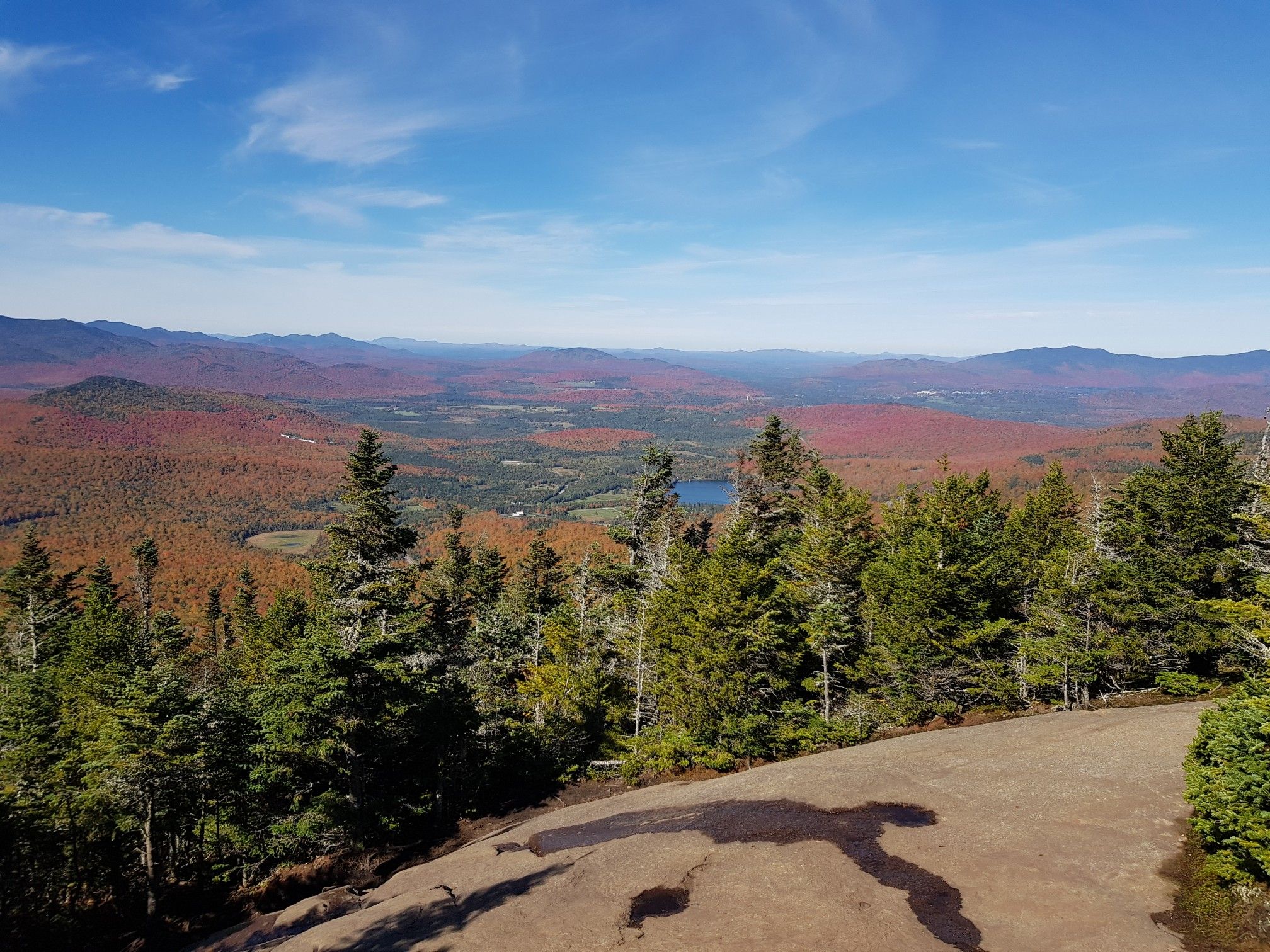 Vast autumn mountain landscape with a lake under a bright blue sky. - Cascade and Porter Mountain Trail