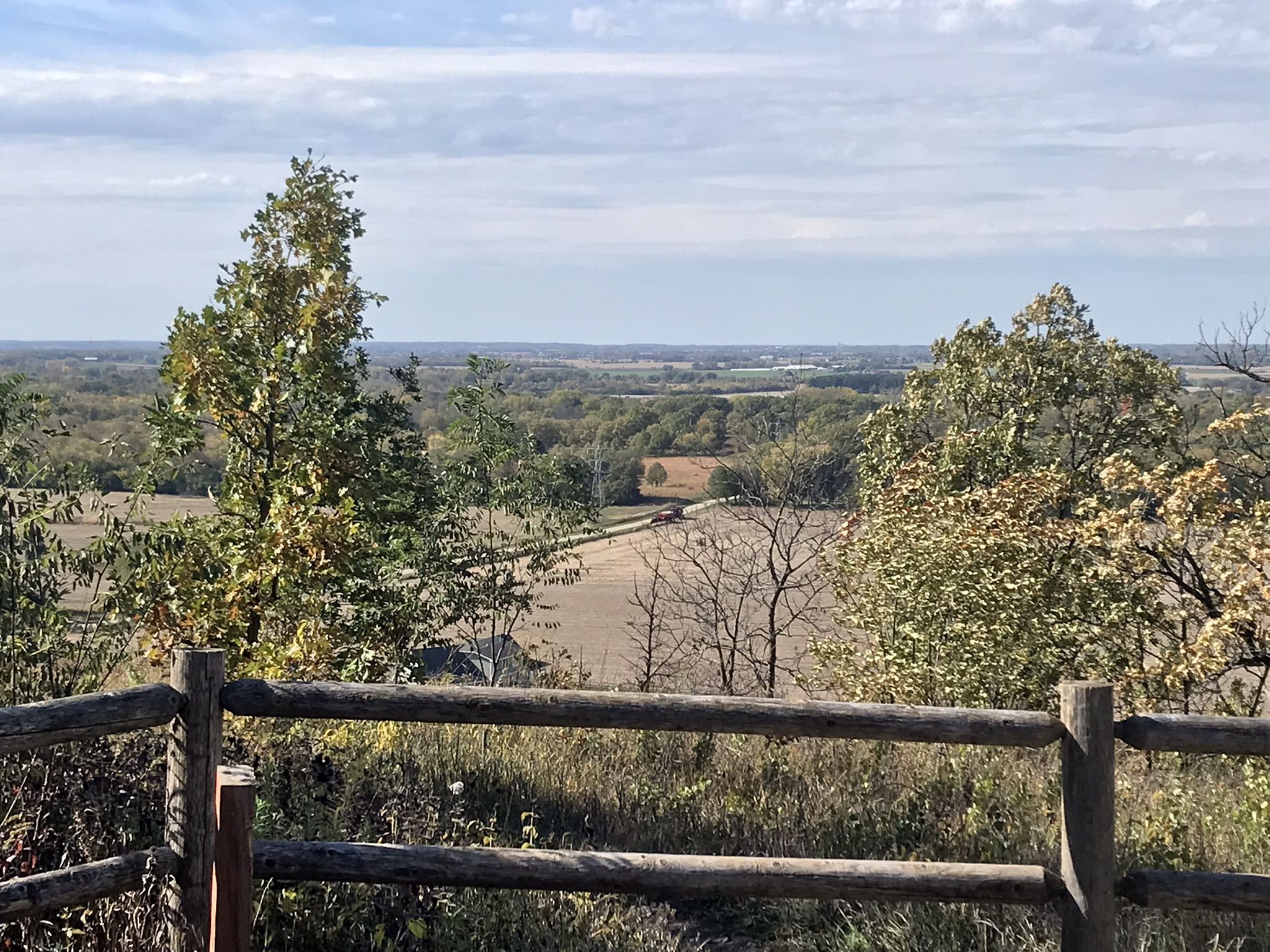 Panoramic view of a valley with fields and trees under an overcast sky. - Bald Bluff and Ice Age Trail Loop
