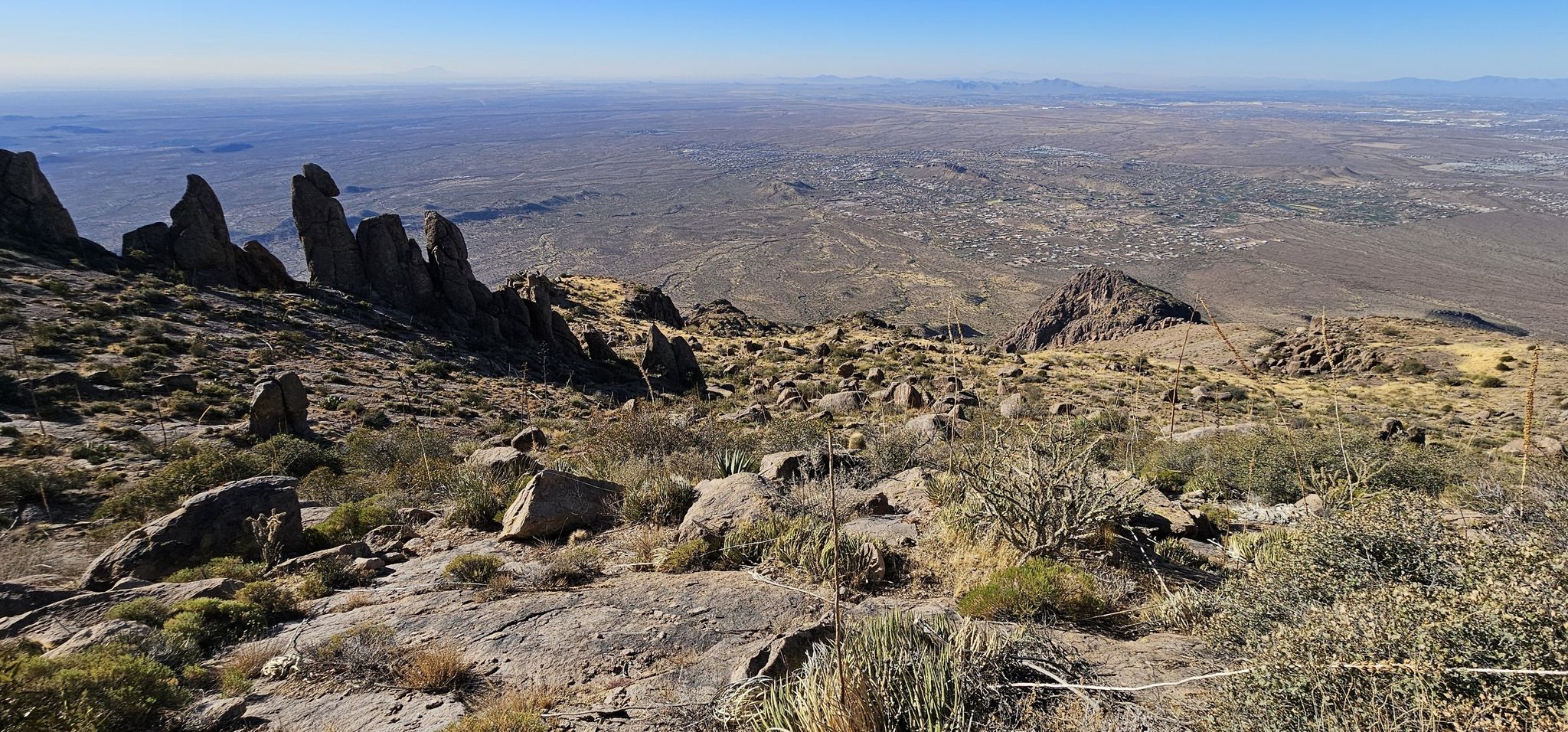 Rocky desert peaks overlook vast arid plains under bright daylight. - Superstition Peak via Carney Springs Trail