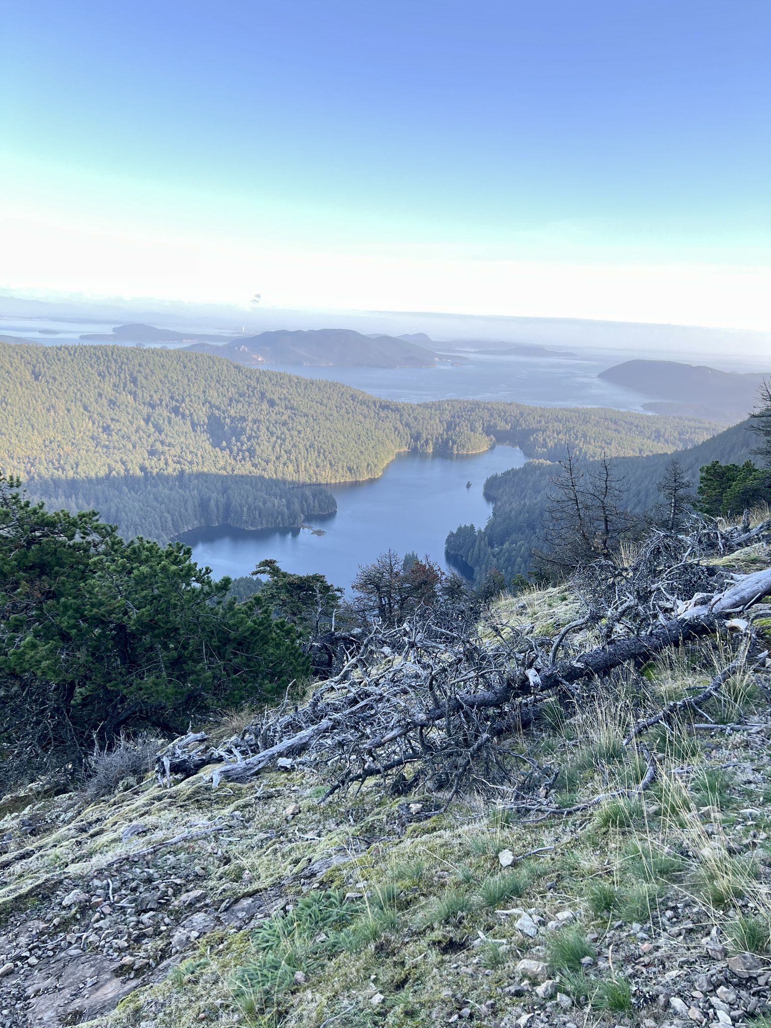 High mountain view of a lake, forested hills, and distant islands. - Mount Constitution, Little Summit via Cold Springs, North Boundary Loop