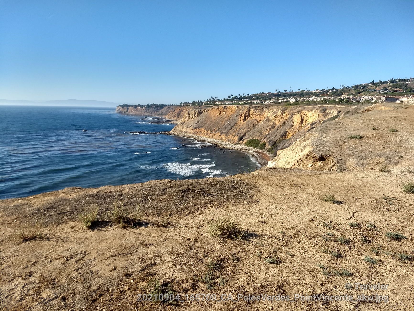 Coastal cliffs meet blue ocean under a clear sky on a sunny day. - Alta Vicente and Seascape Trail Loop