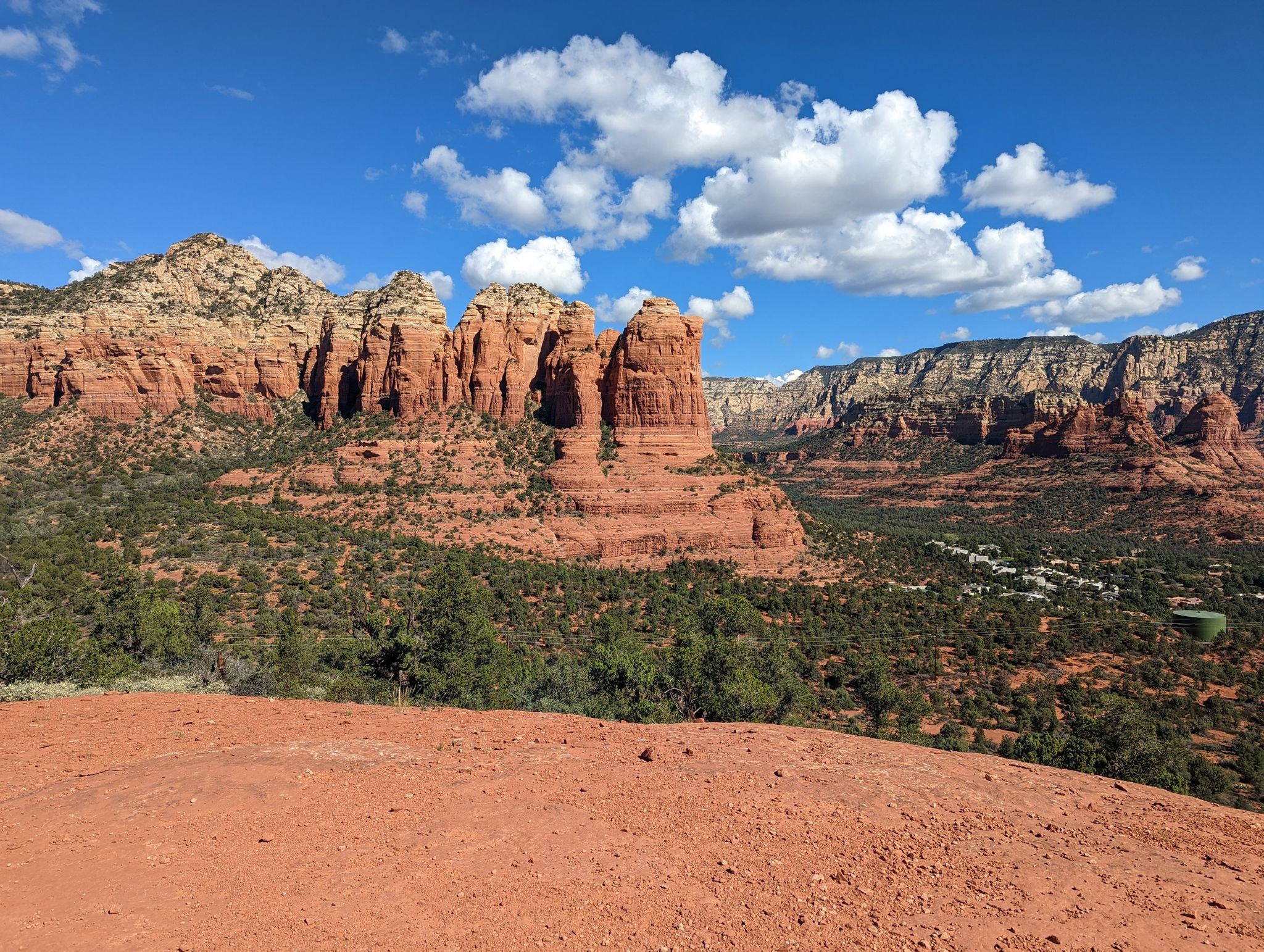 Expansive red rock landscape with scattered clouds in a vibrant blue sky. - Teacup Trail to Sugarloaf Summit