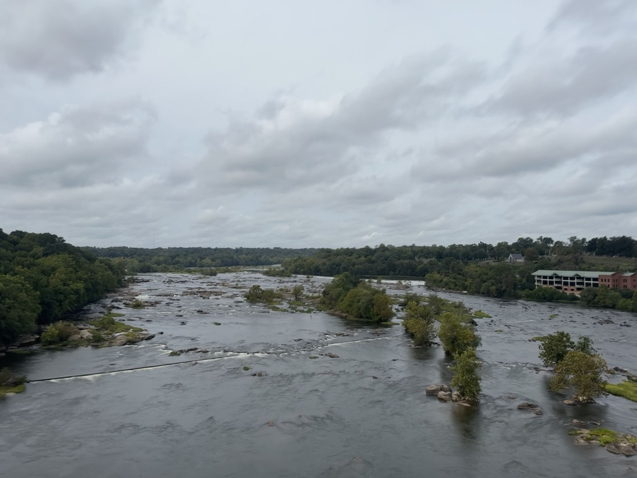 Wide river with rapids and small tree islands under an overcast sky. - James River Park Pony Pasture – Brown's Island loop from Richmond Main Street