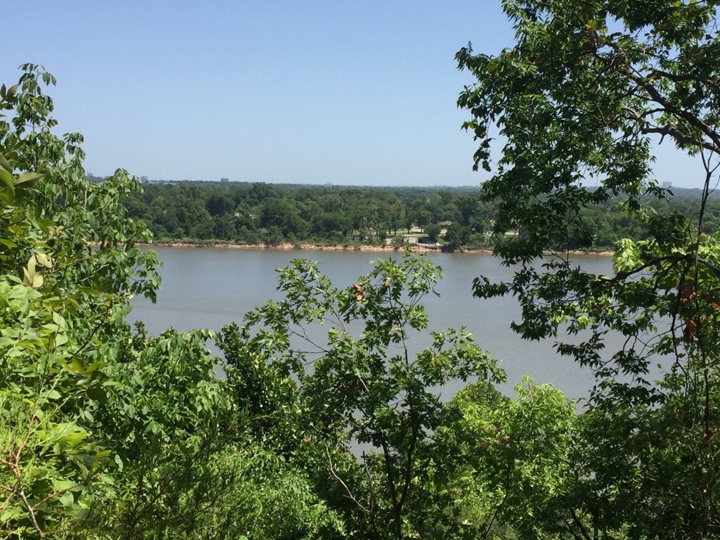 River framed by lush green trees on a bright, clear day. - Pepsi Lake – View of the Arkansas River loop from Turkey Moutain - Upper Lot