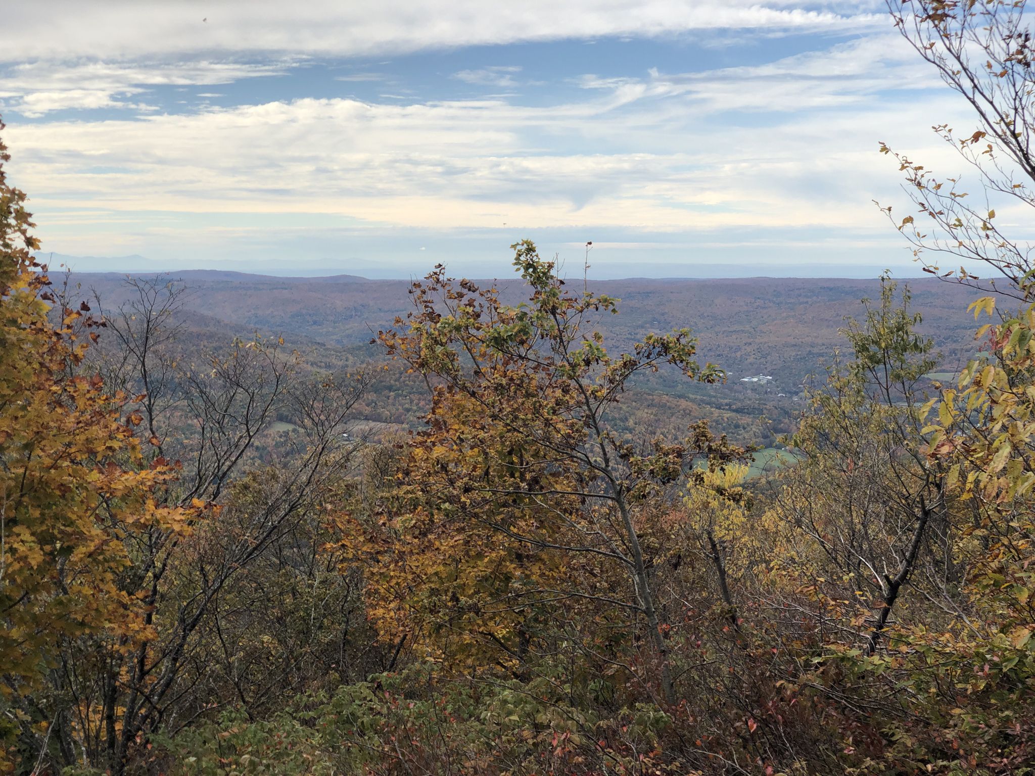 Panoramic view of rolling hills and autumn trees under a partly cloudy sky. - Taconic Crest Trail to White Rock and Snow Hole