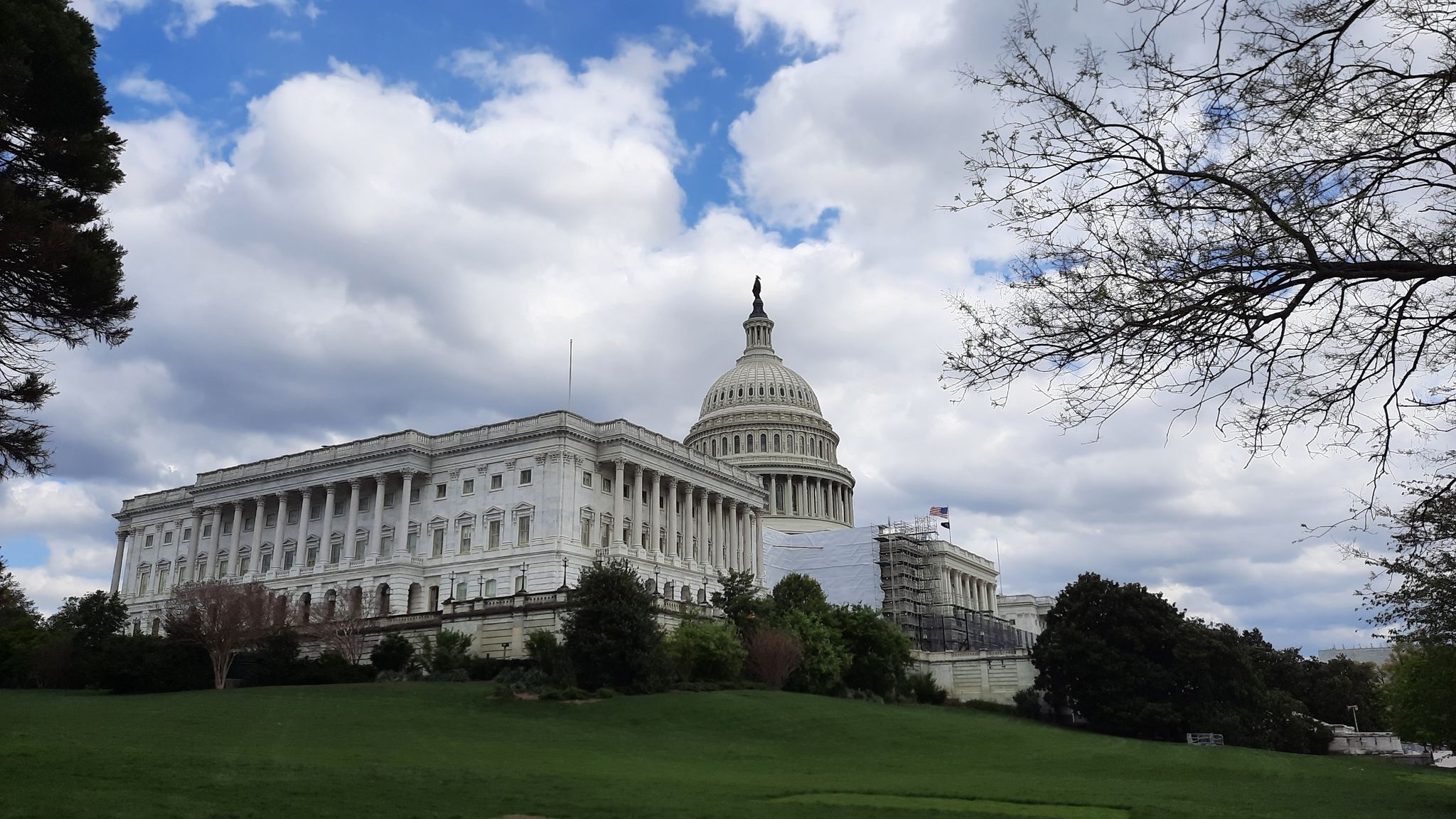 Domed building on a green hill under a dramatic cloudy sky. - U.S. Capitol – National Mall loop from Eastern Market