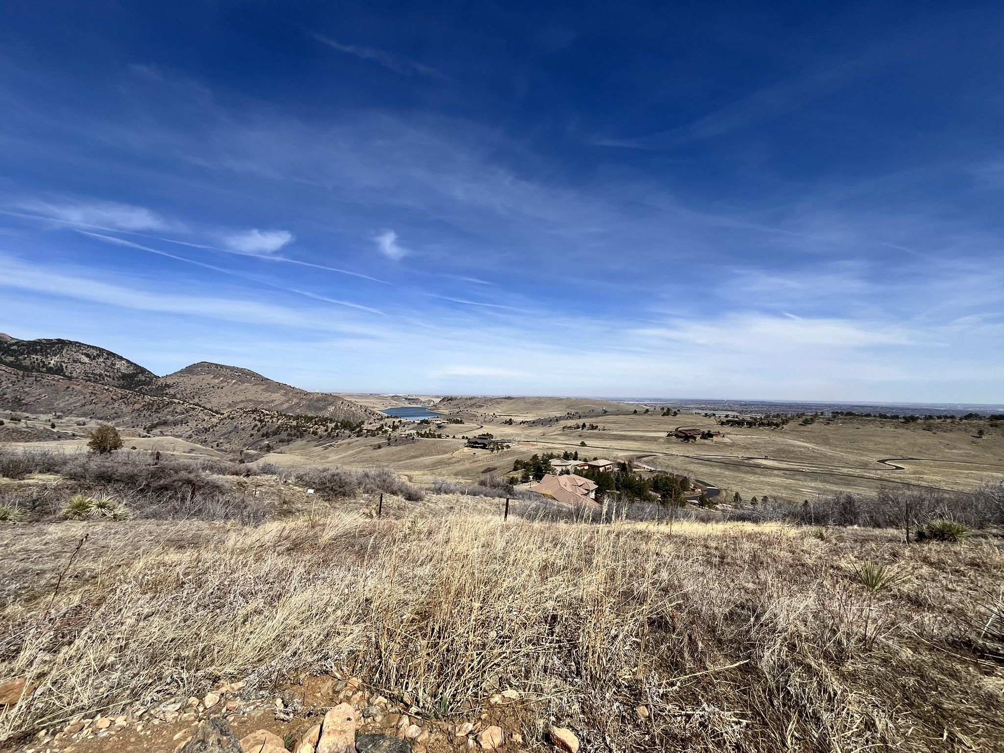 Expansive view of dry, rolling hills and plains under a vast blue sky. - Belcher Hill, Longhorn, and Maverick Trail Loop