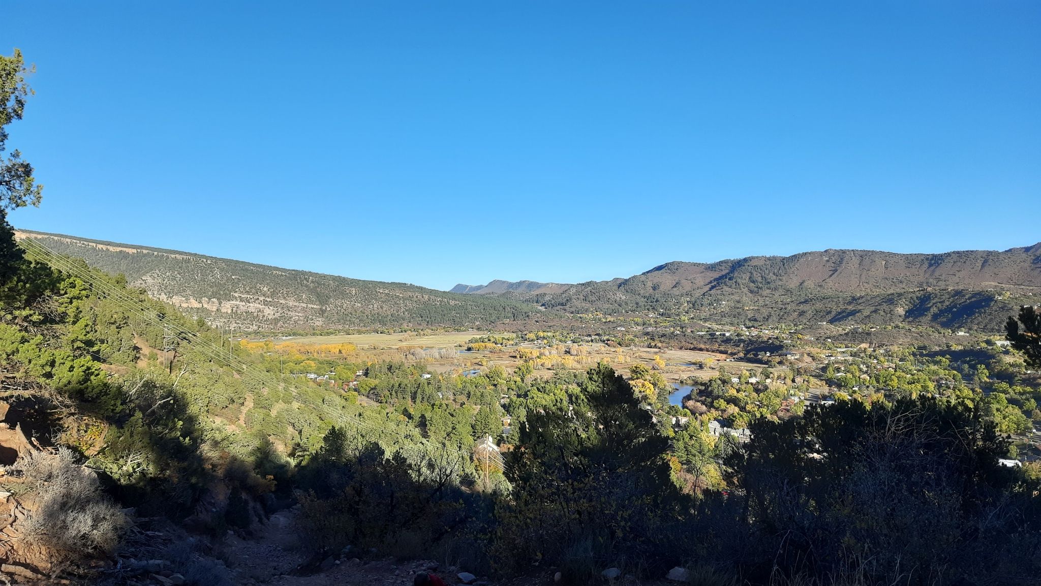 Panoramic view of a wide valley with a river and distant town. - Animas Mountain Trail – Animas Mountain East Trailhead loop from La Plata