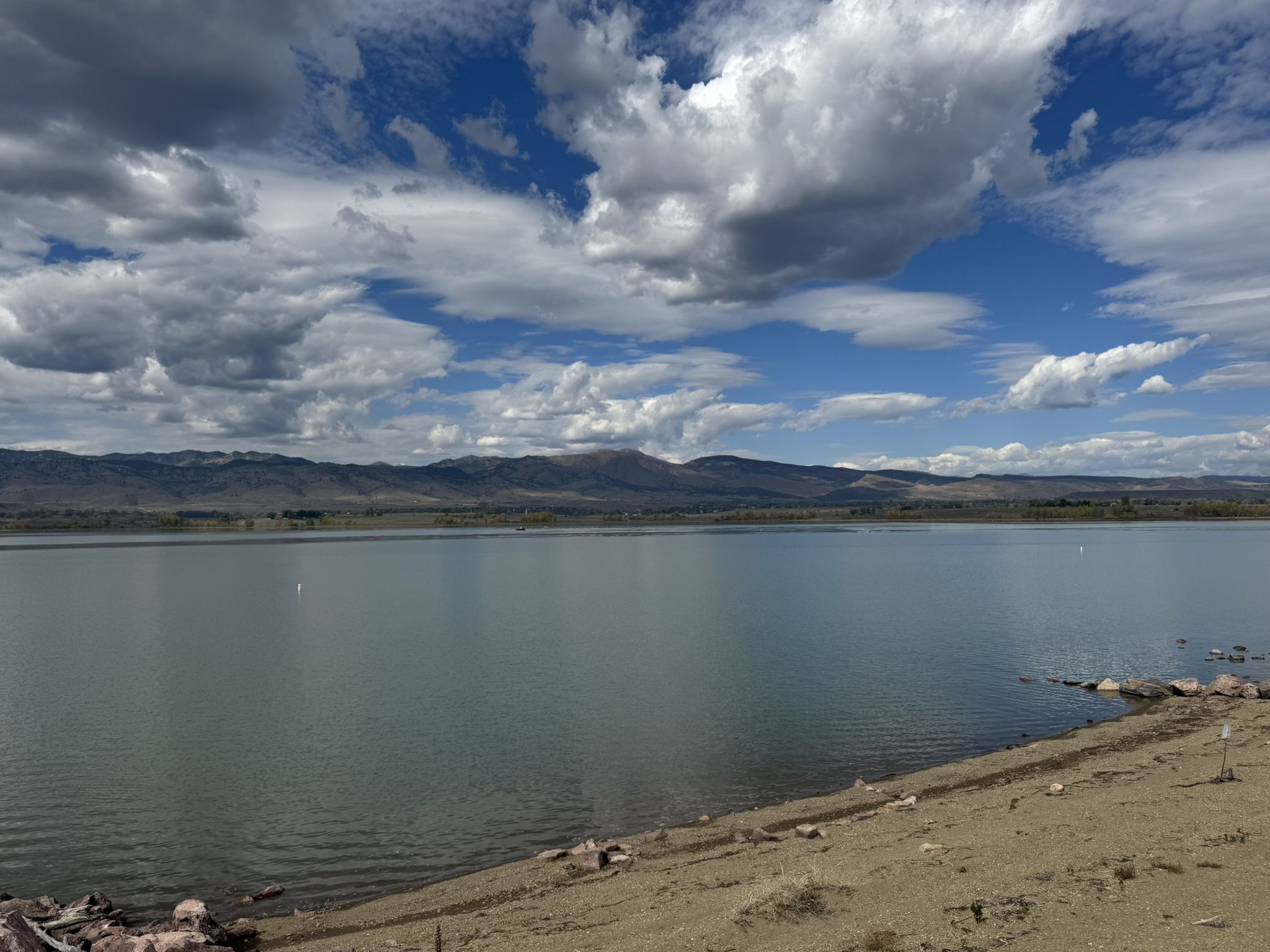 Wide lake view with mountains in the distance under a dramatic cloudy sky. - Longmont, Boulder Reservoir and Gunbarrel loop via the LOBO Trail
