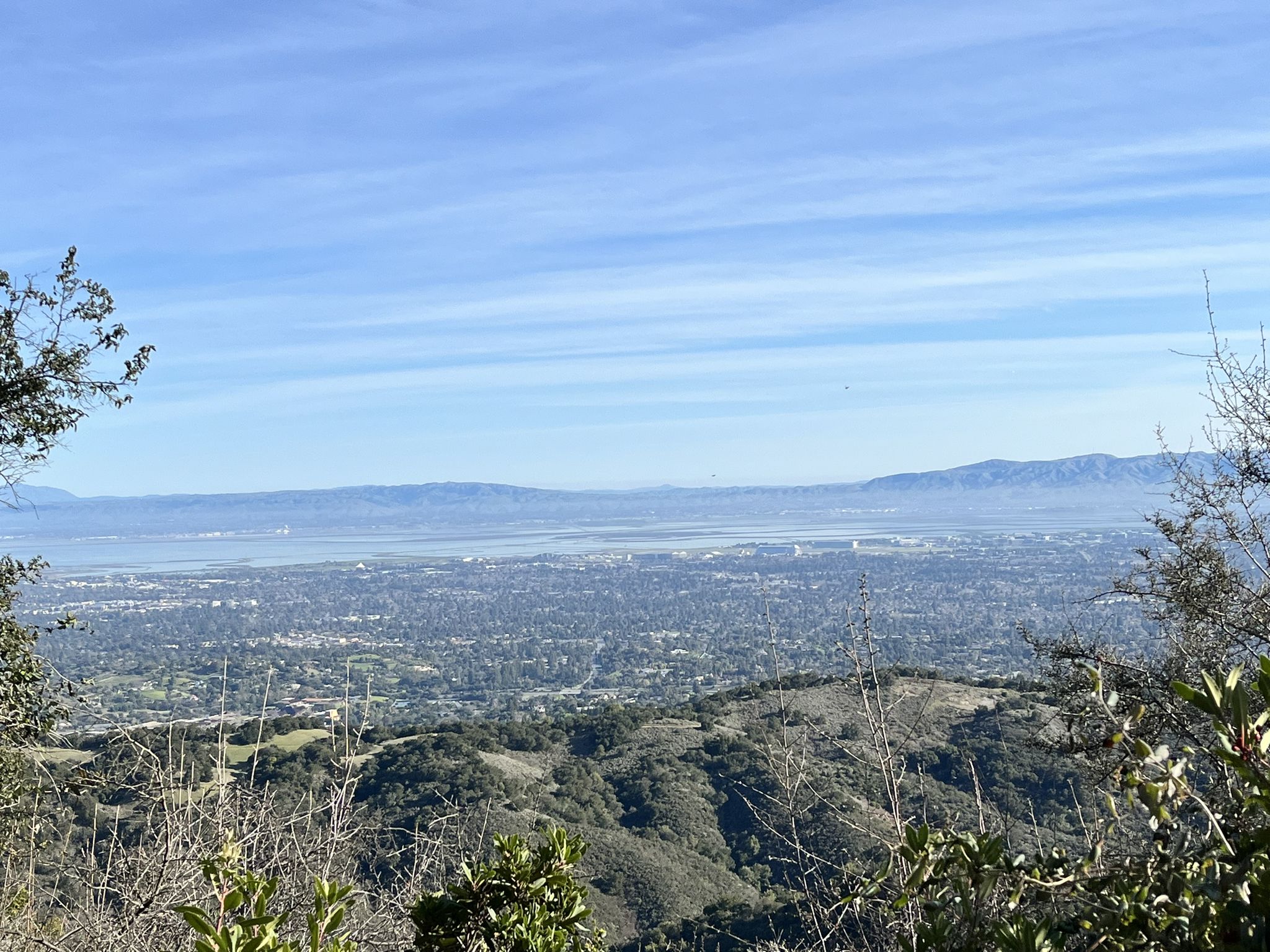 Expansive view of a city, water, and distant mountains under a clear blue sky. - Stephen E. Abbors, Wildcat, and Coyote Trail Loop
