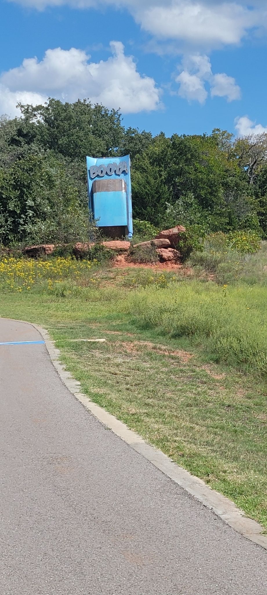 Curved paved path next to a large blue sign and green trees. - Lake Draper Trail – Lake Stanley Draper loop from Oklahoma City