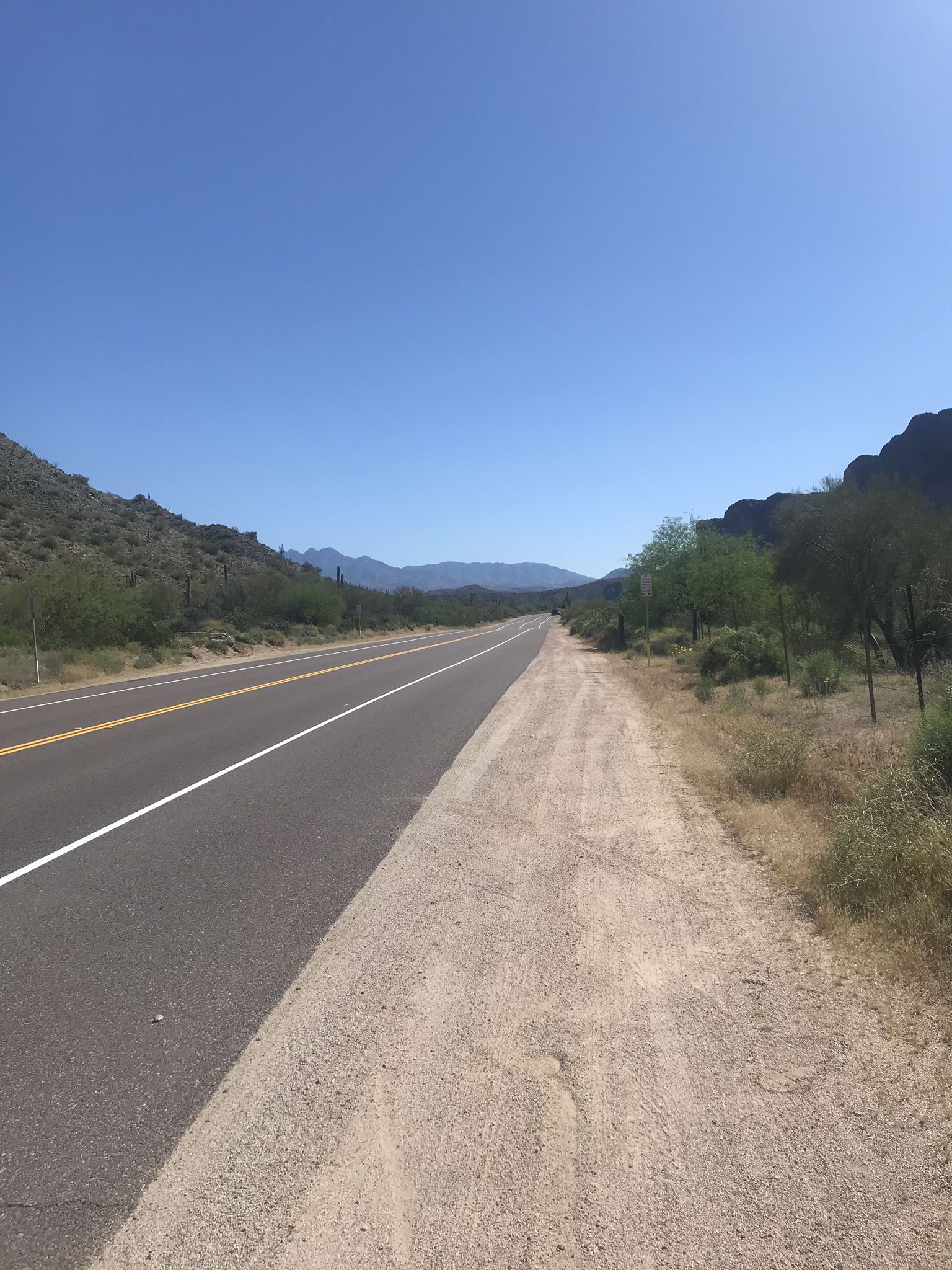 A long paved road and dirt path stretch through a desert landscape. - Usery Mountain Regional Park – Maricopa Trail in Tonto National Forest loop from Velda Rose Estates