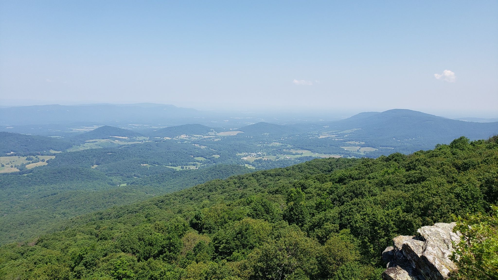 Vast green mountain landscape with distant peaks under a bright blue sky. - South Mount Marshall Viewpoint