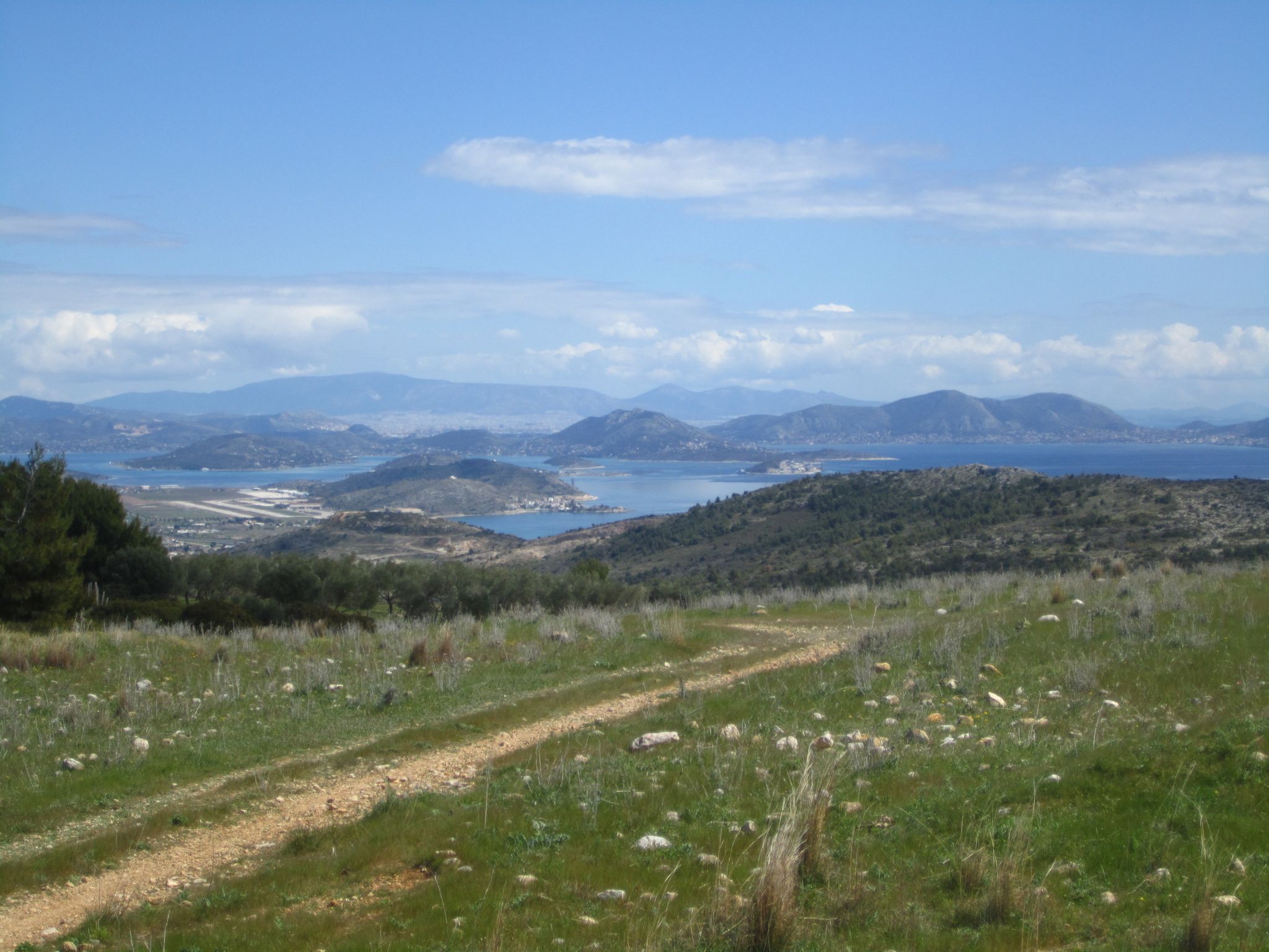 The islnd of Salamis in the distance and beyond that you can just make out the sea of concrete of the city of Athens
