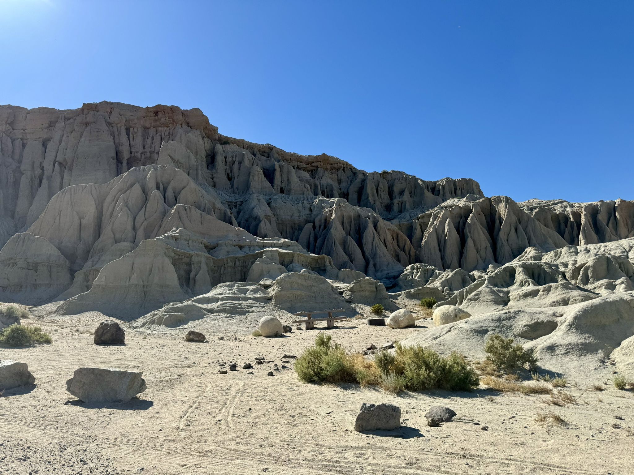 Eroded light-colored rock formations in a sunny desert landscape. - Ricardo Campground