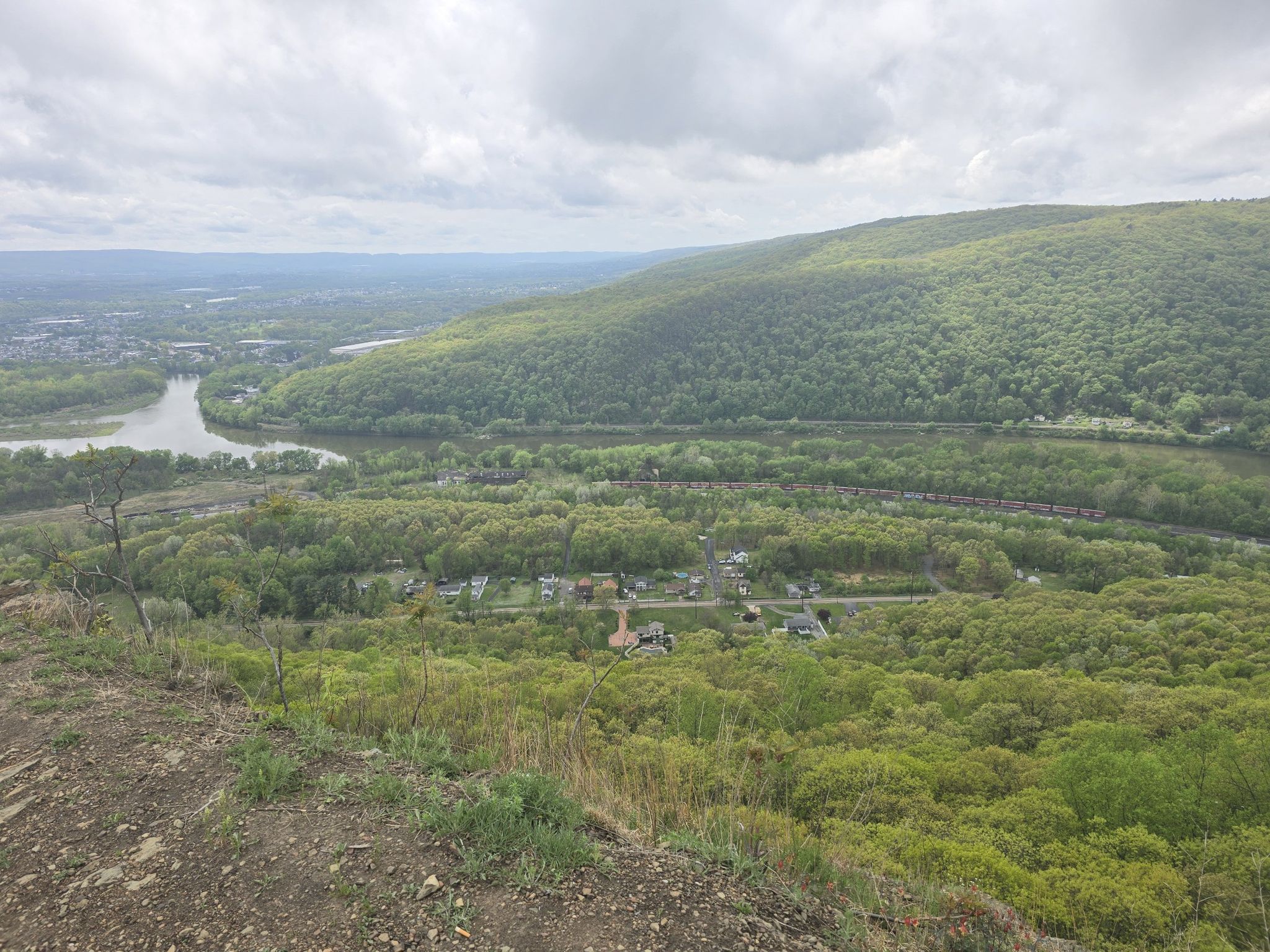 Overcast panoramic view of a winding river through a lush green valley. - Campbell's Ledge and Reservoir Loop