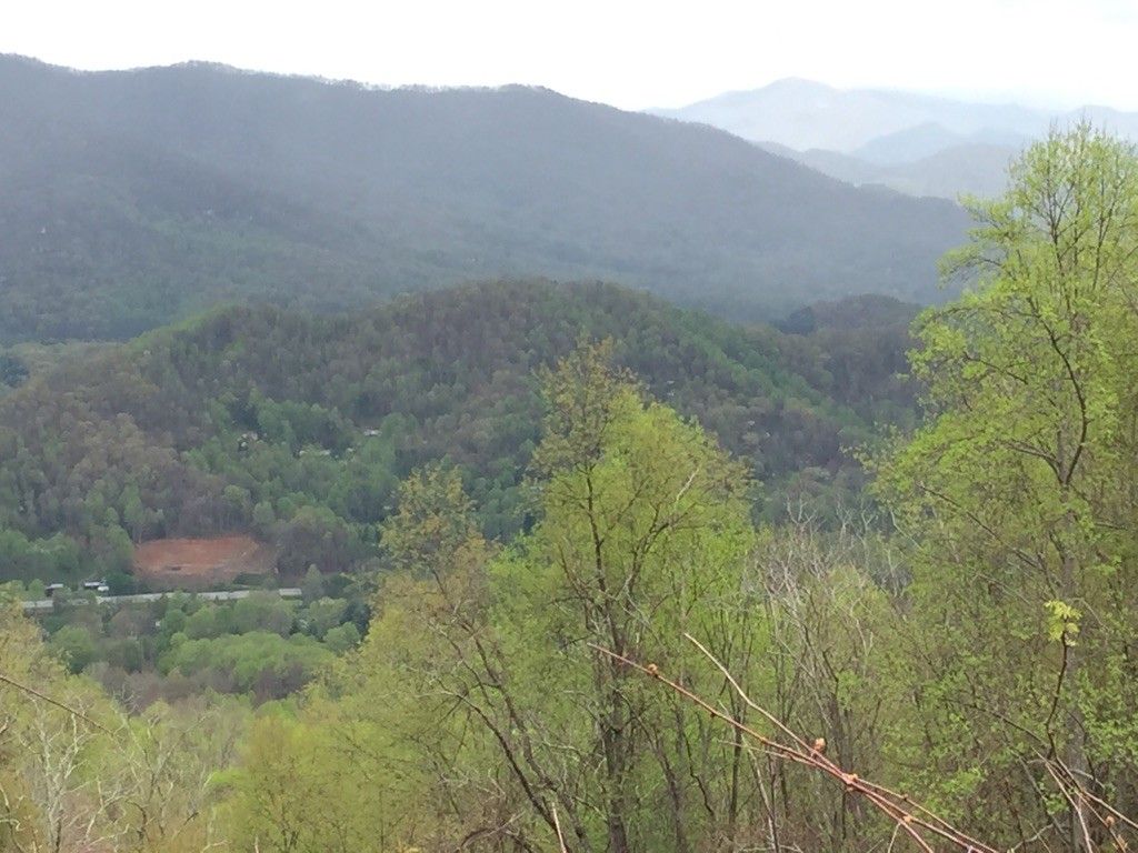 Overcast view of lush green forested mountains and a valley below. - Balsam Gap Overlook to Richland Balsam Overlook