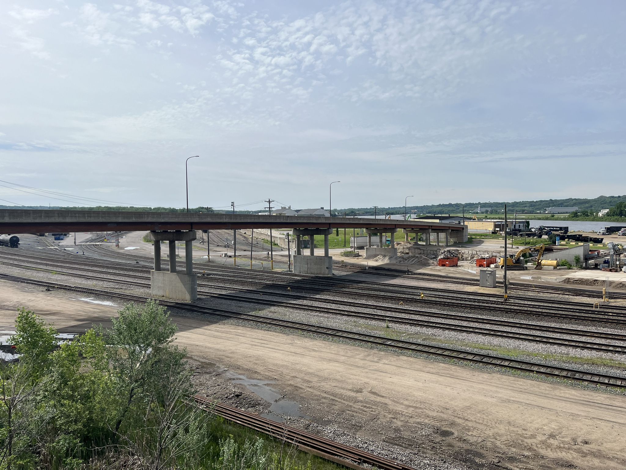 Elevated concrete bridge over multiple railway tracks and industrial area. - Lake Phalen – Bruce Vento Regional Trail loop from Maplewood