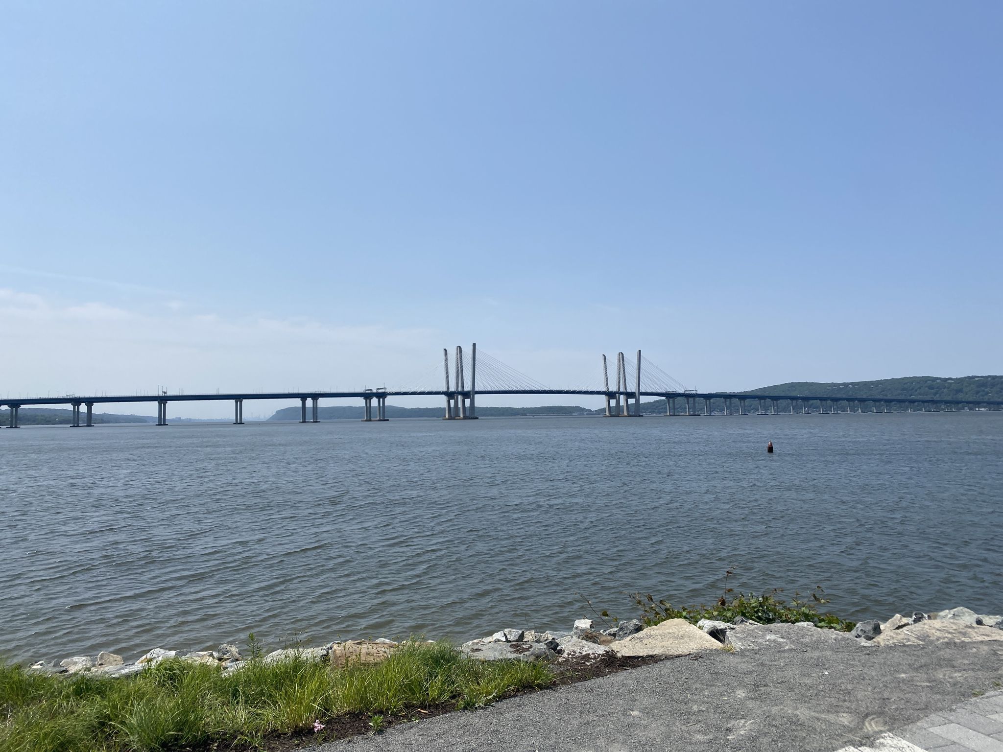 Wide view of water with a long, cable-stayed bridge in the distance. - Tarrytown Light loop from Tarrytown