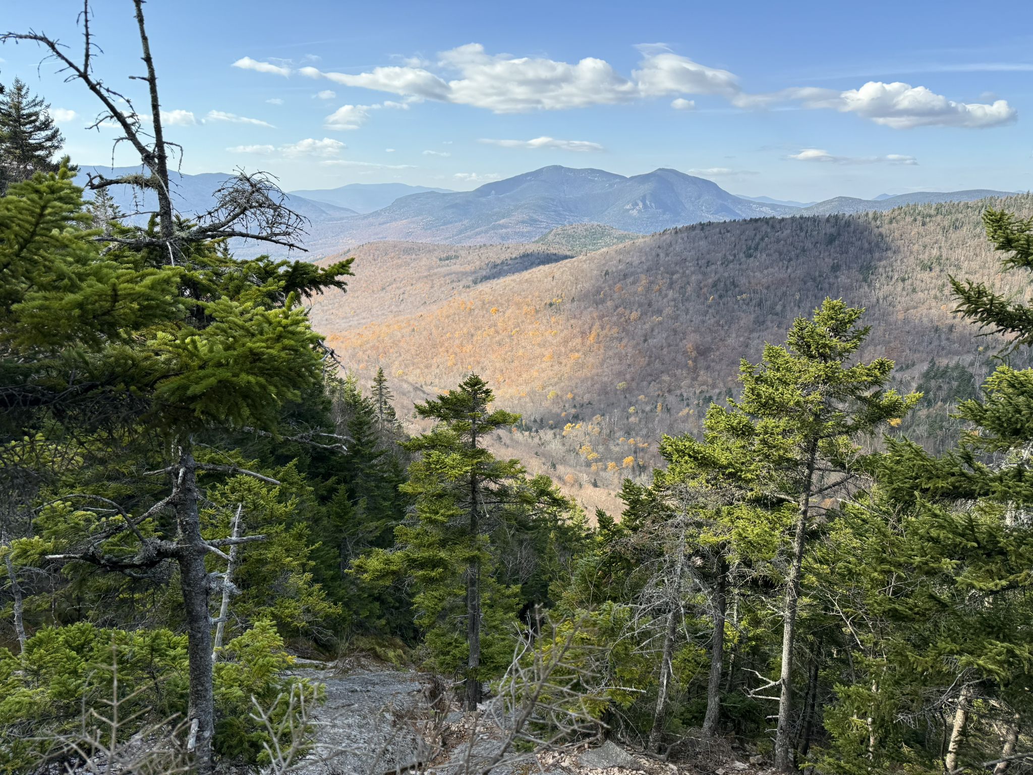 Panoramic view of forested mountains and valleys under a partly cloudy sky. - Waterville Valley and Waterville Valley Road loop gravel