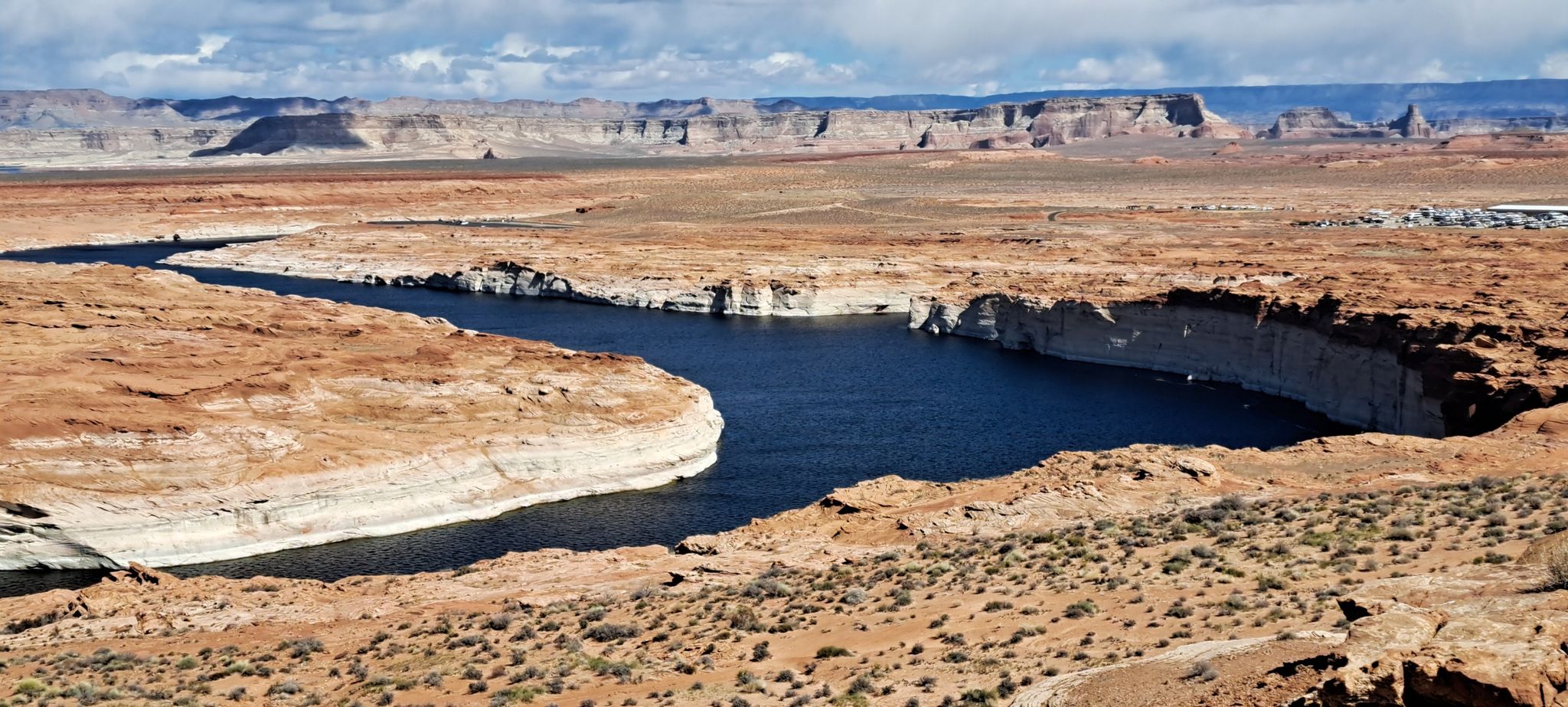 Blue river winds through red rock canyons, vast arid landscape. - Page Mesa Overlook loop from Page