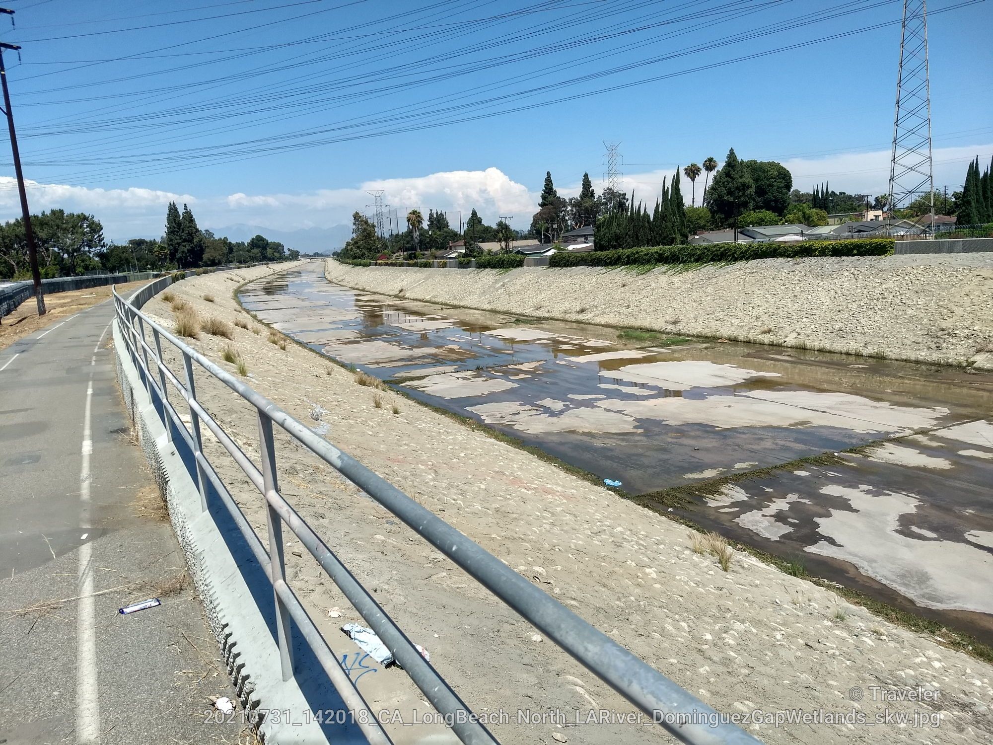 Paved path next to a concrete channel with shallow water under a clear sky. - Rio Hondo Bikeway – Rio Hondo Bike Bridge loop from Montebello