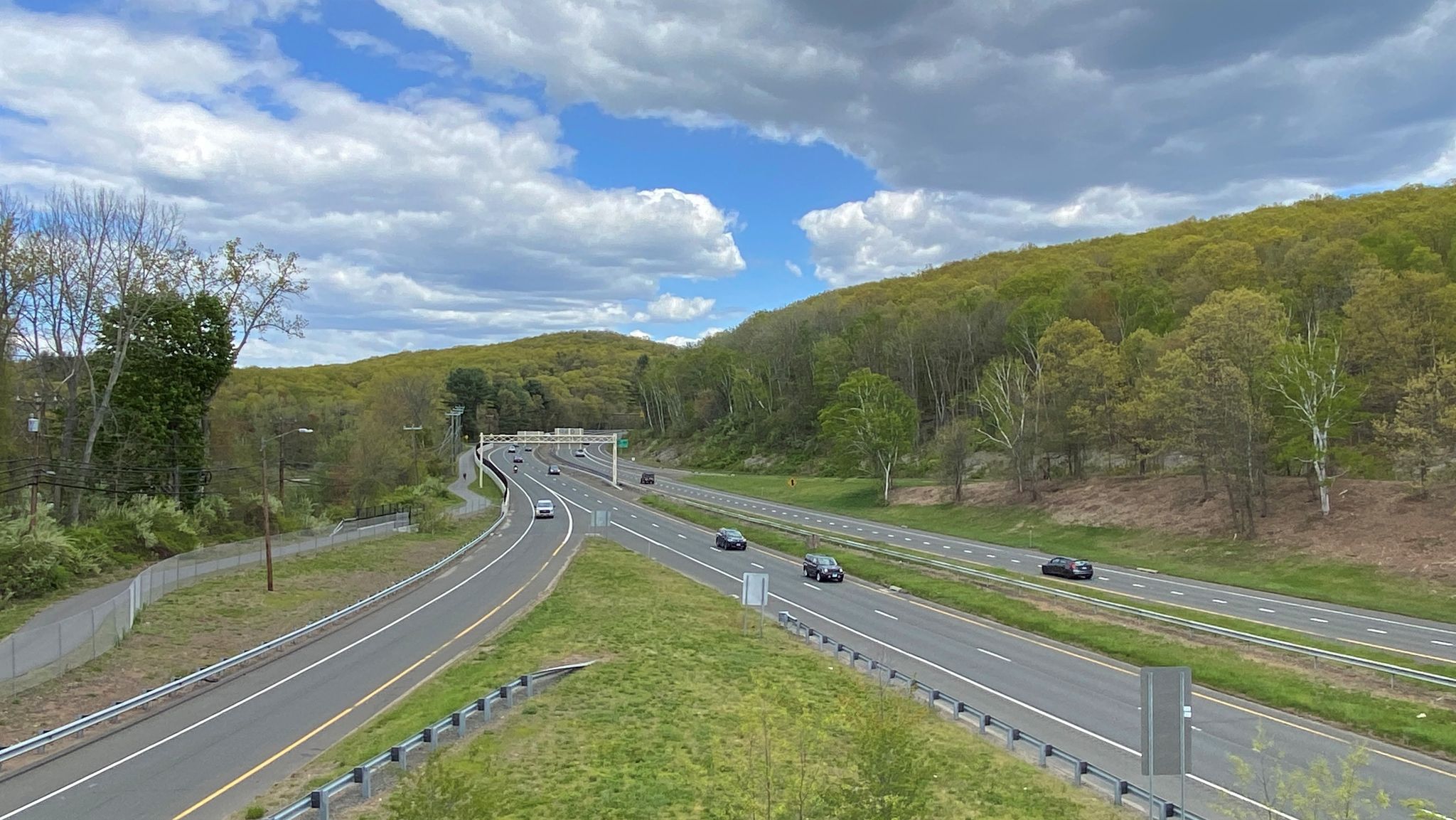 Overhead view of a highway intersection with cars, surrounded by green hills. - Gay City State Park – Upper Case Pond loop from East Glastonbury Fish & Game Association