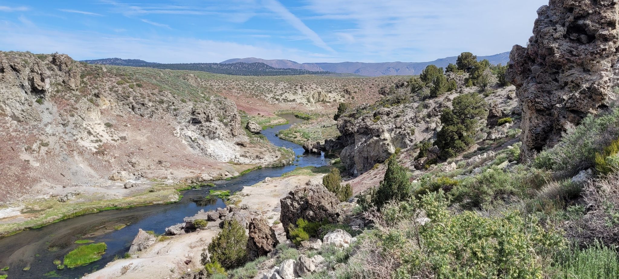 River winding through a rocky canyon under a bright blue sky. - Mammoth Lakes – Hot Creek Geological Site loop from Mammoth Lakes