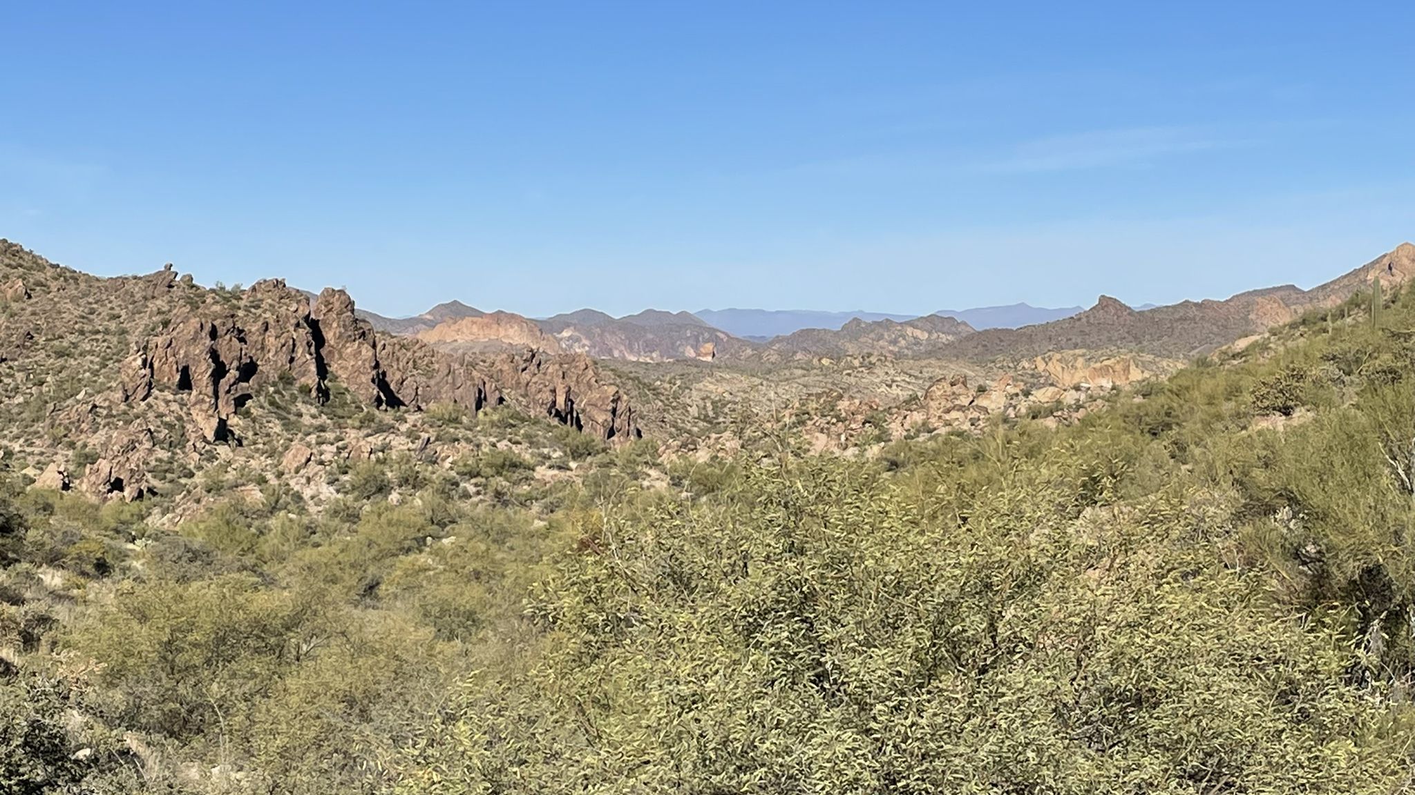 Panoramic view of rugged desert mountains and valleys with green scrub. - Parker Pass via Dutchman’s Trail