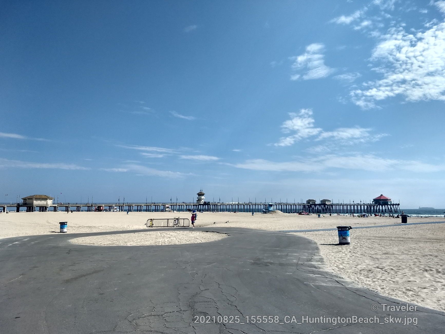 Wide sandy beach with a long pier and a paved path under blue sky. Bright day. - Huntington State Beach – Huntington State Beach loop from Huntington Beach