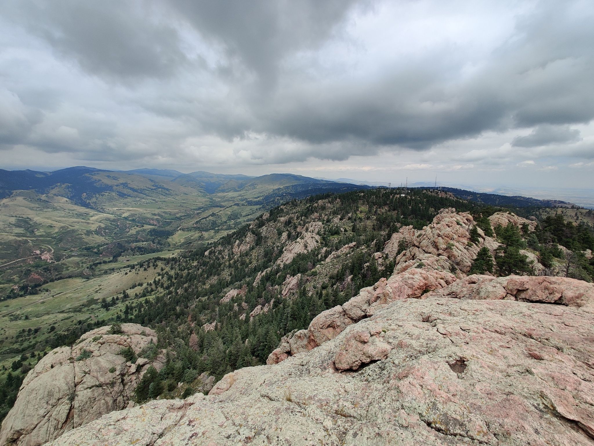Panoramic view of rocky peaks and green valleys under a cloudy sky. - Horsetooth Rock via Swan Johnson and Wathan Trail